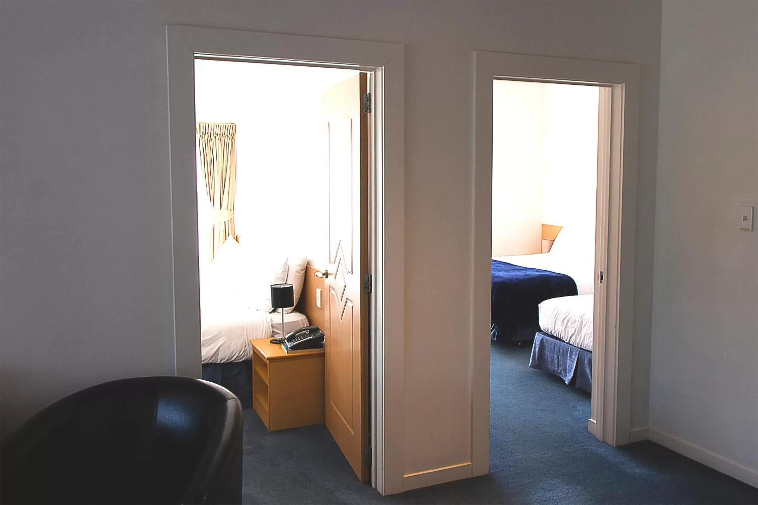 Bedroom, Seating Area in Saxton Lodge Motel