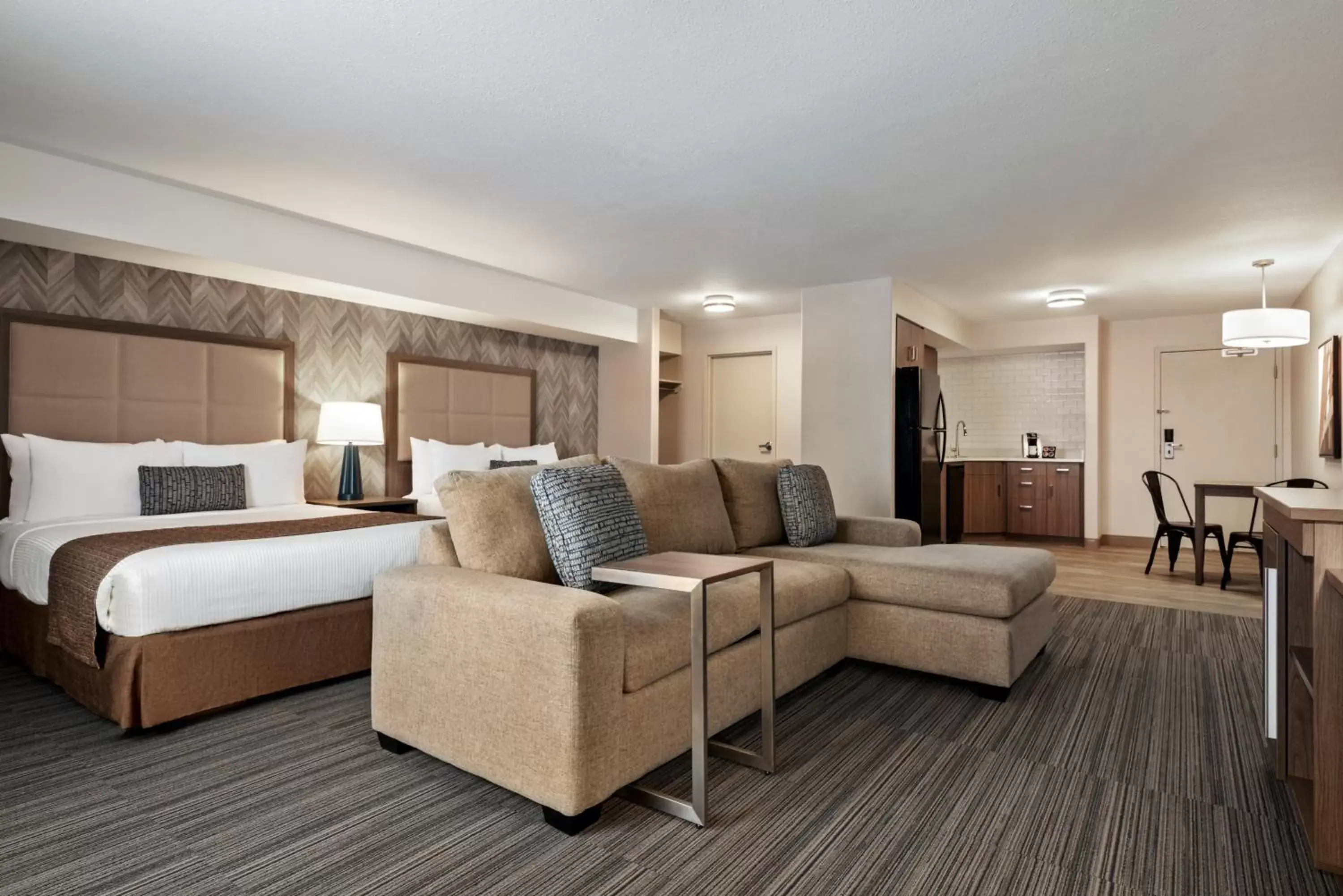 Photo of the whole room, Seating Area in Ramada by Wyndham Airdrie Hotel & Suites