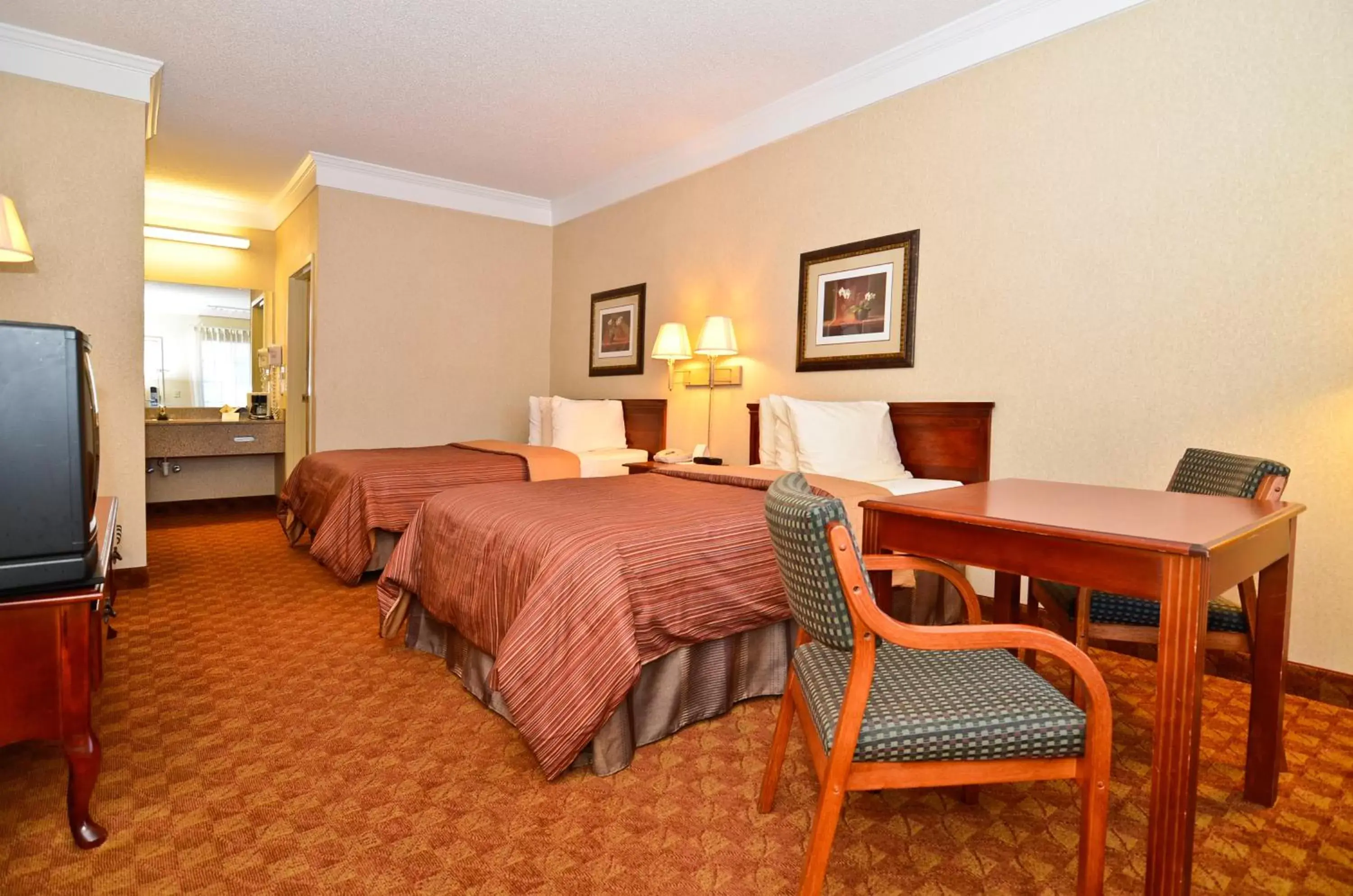 Photo of the whole room, Bed in Peach State Inn & Suites Photo of the whole room, Bed in Peach State Inn & Suites
