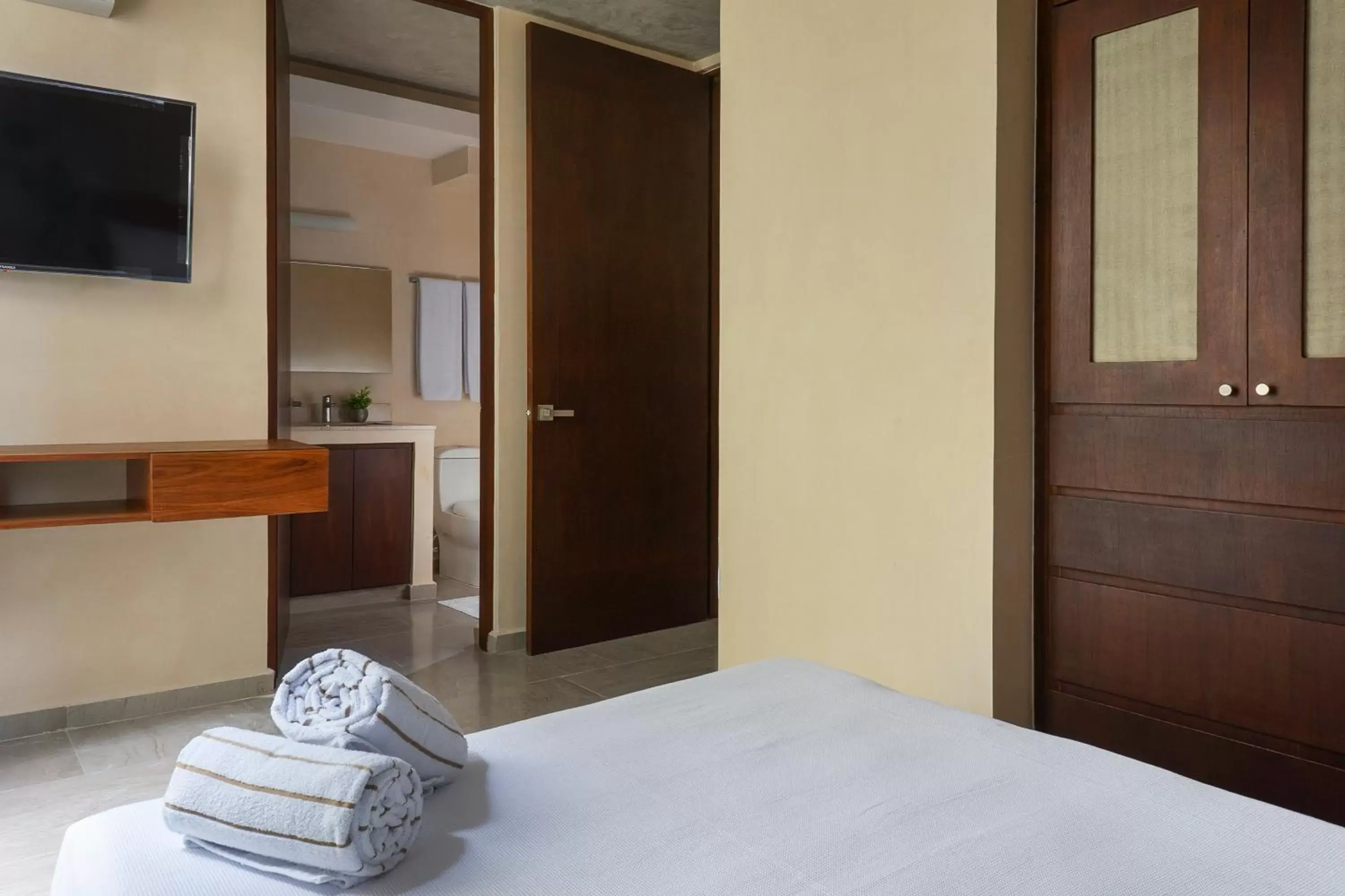 Bed in ARUNA TULUM-Luxury Studios & Apartments