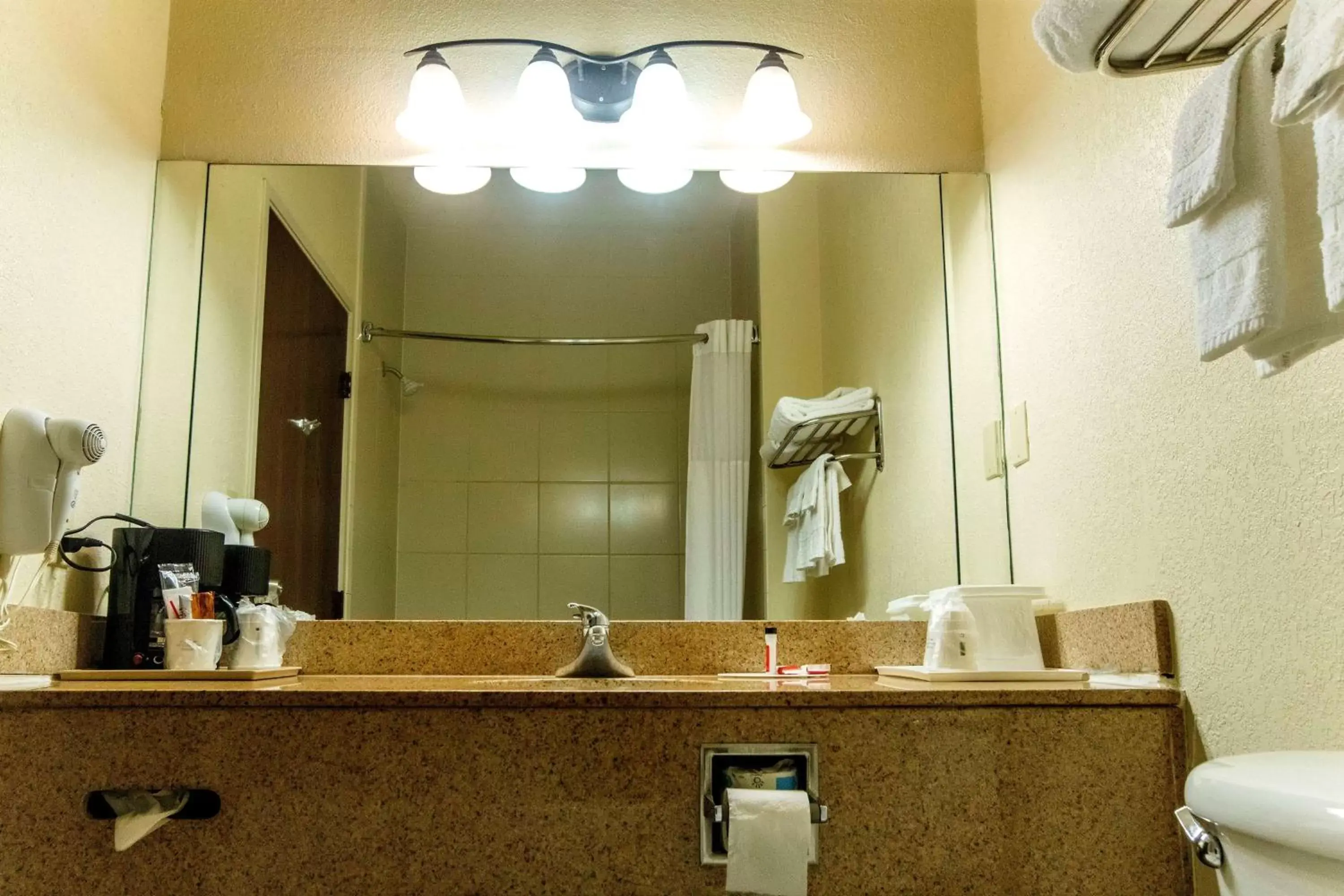 Bathroom in Days Inn & Suites by Wyndham Houston North/Aldine