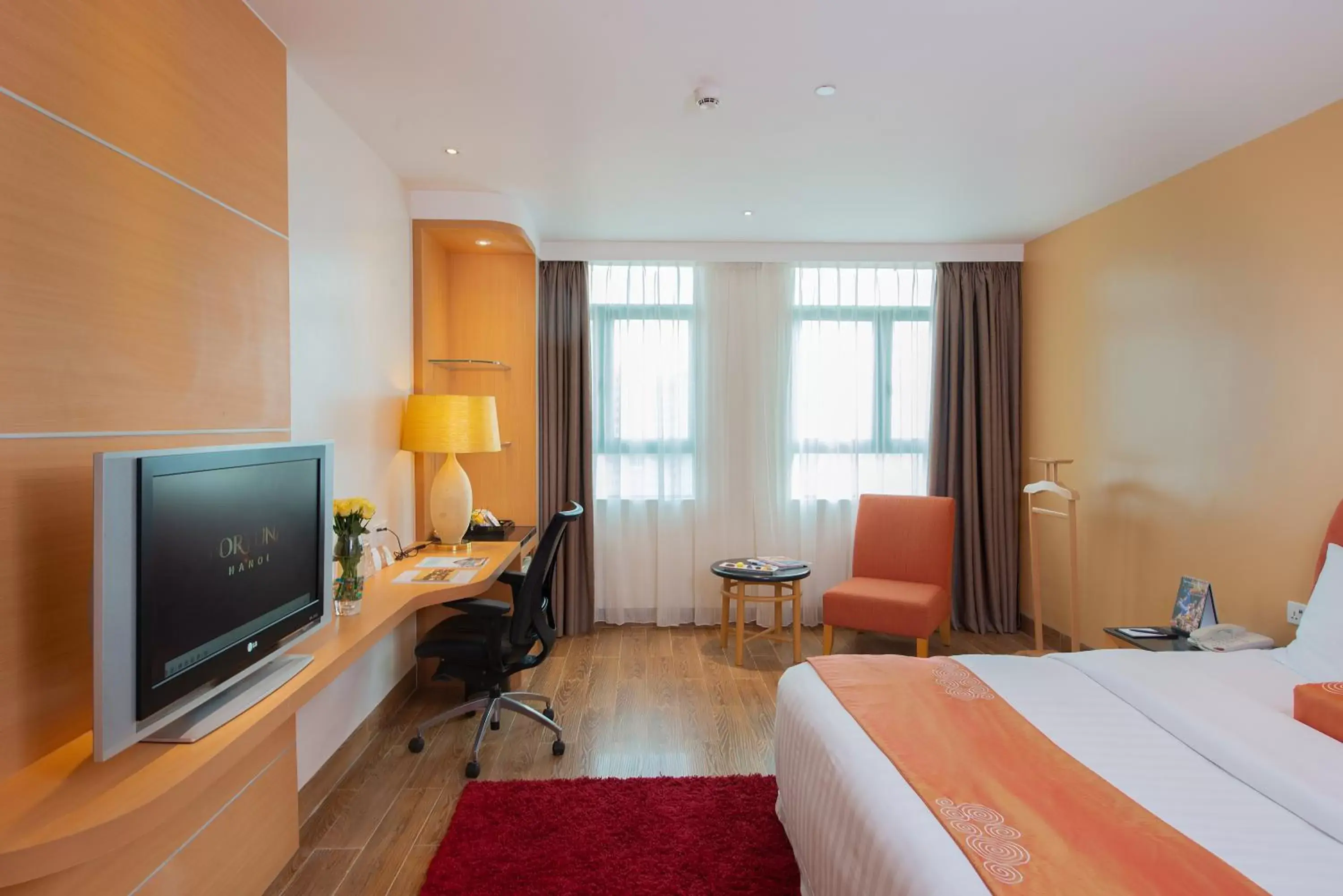 Bed, TV/Entertainment Center in Fortuna Hotel Hanoi