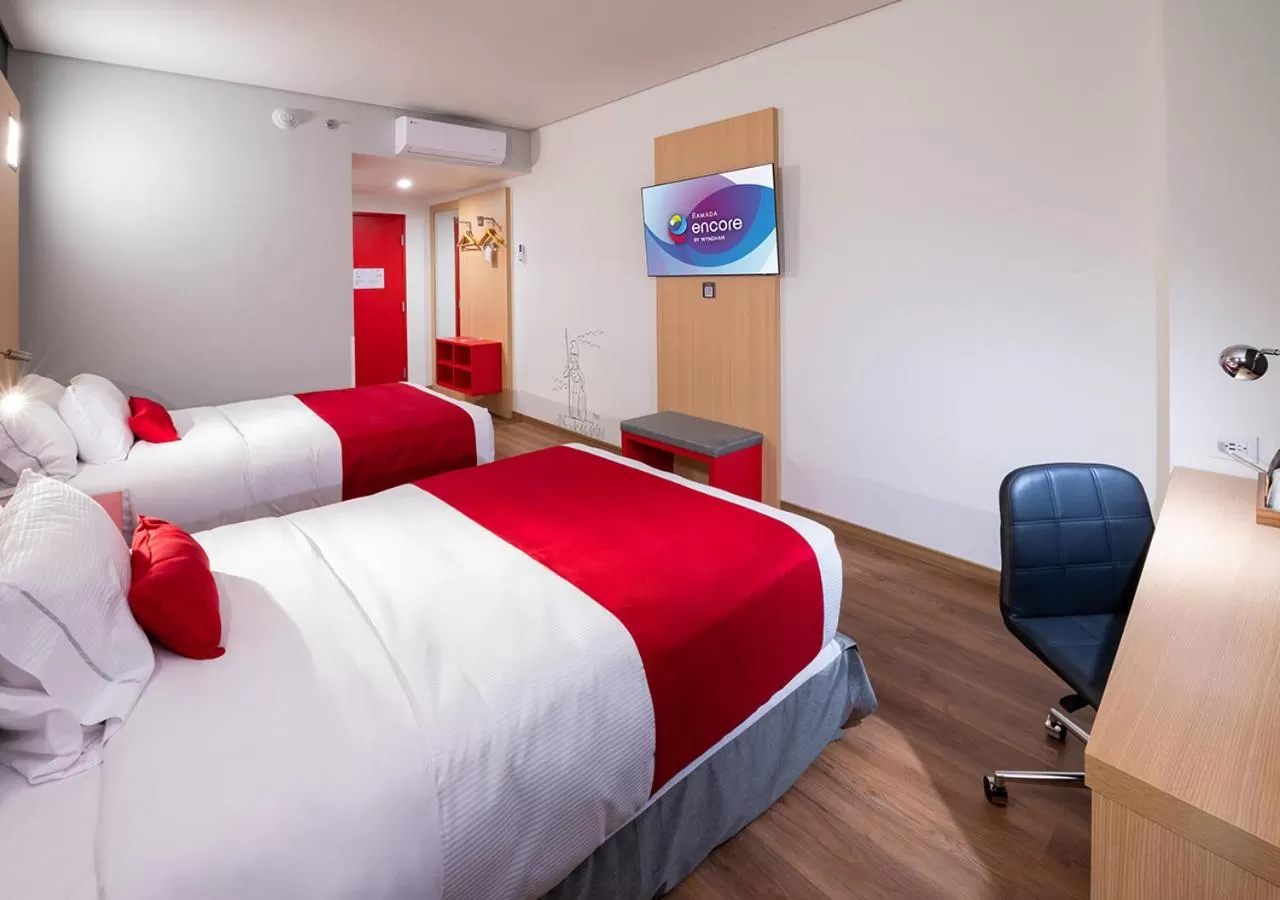 Bedroom, Bed in Ramada Encore by Wyndham Guadalajara Aeropuerto