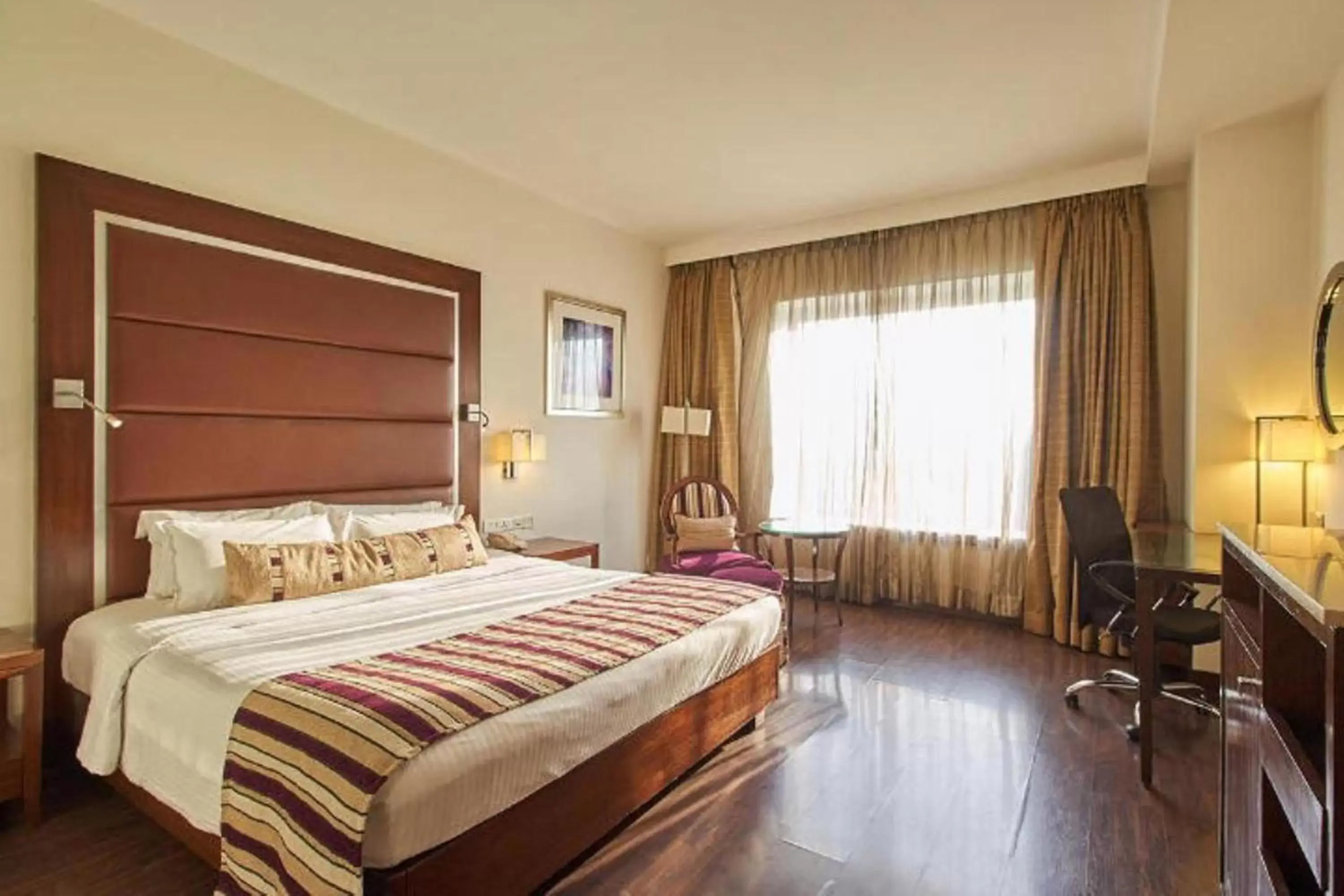 Bedroom in Royal Orchid Central, Pune