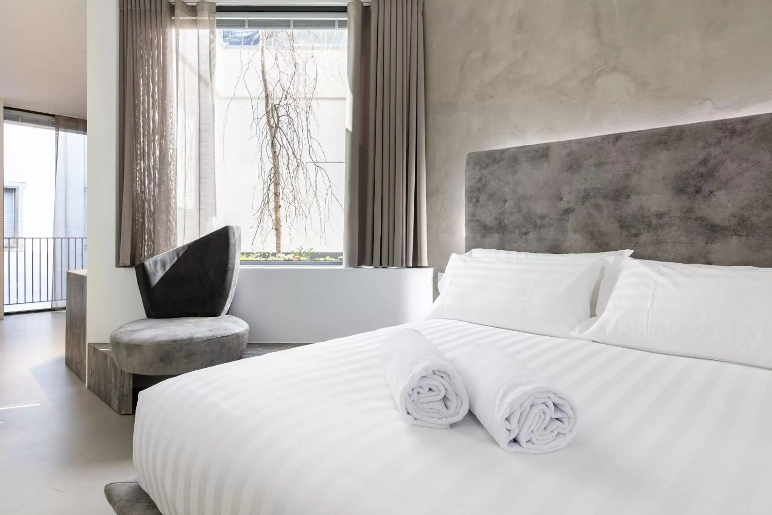 Bed in DOMUS CAVOUR Rooms&Suites