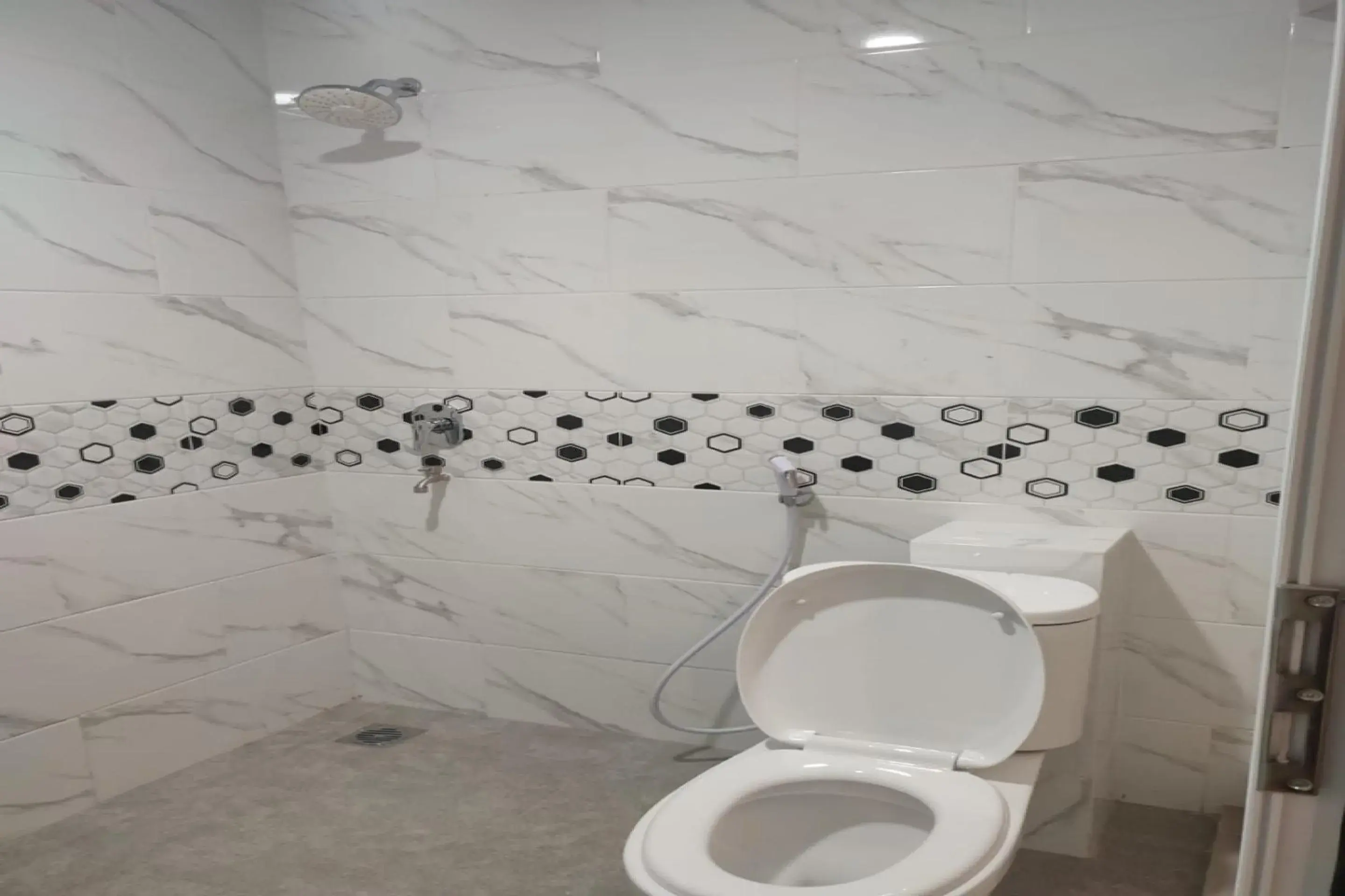 Bathroom in OYO 2018 Ring Road Guest House Syariah