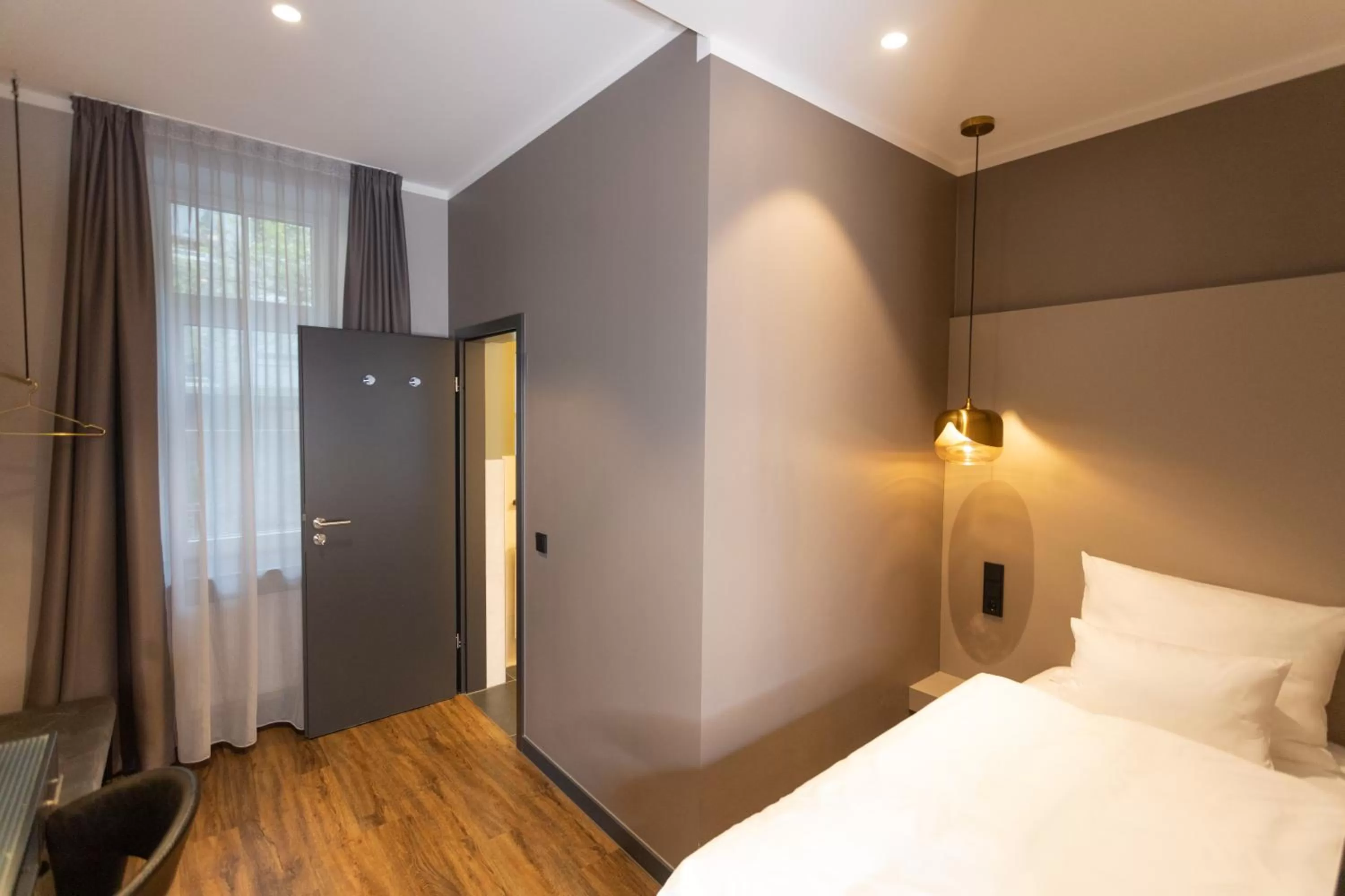 Photo of the whole room, Bed in Munich Rooms Hotel