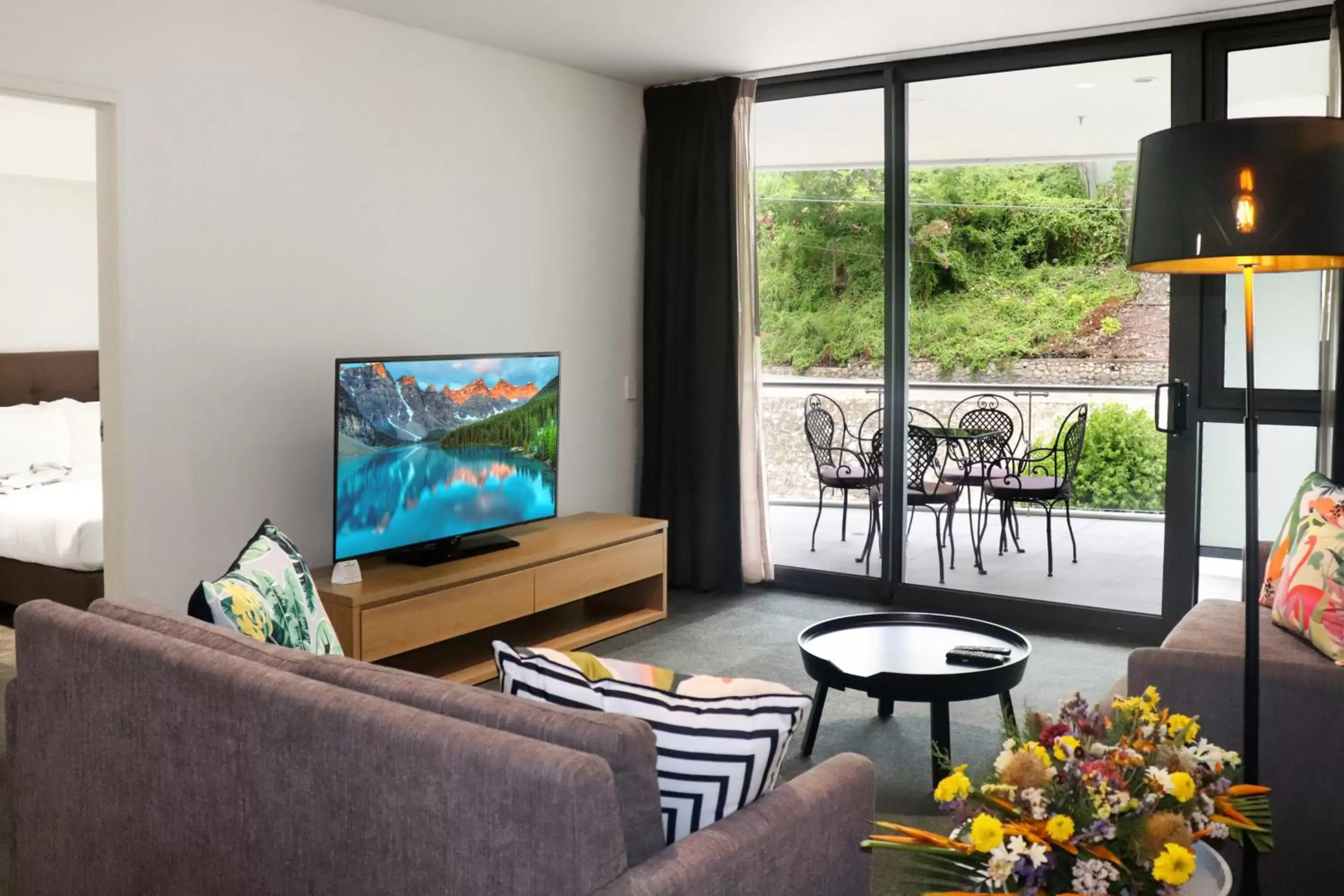 Living room, TV/Entertainment Center in Crowne Plaza Residences Port Moresby, an IHG Hotel