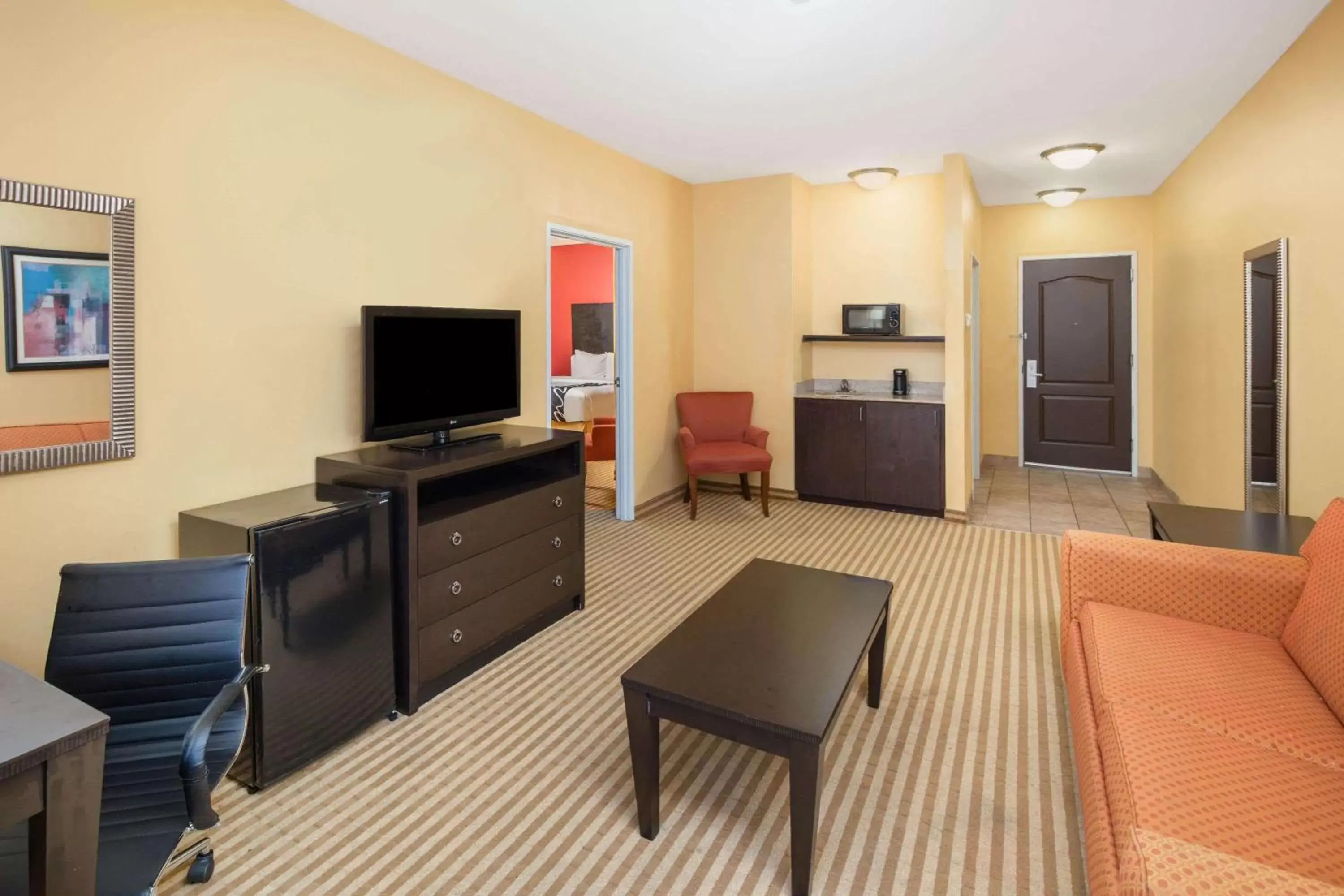 Photo of the whole room, TV/Entertainment Center in La Quinta by Wyndham Atlanta Union City