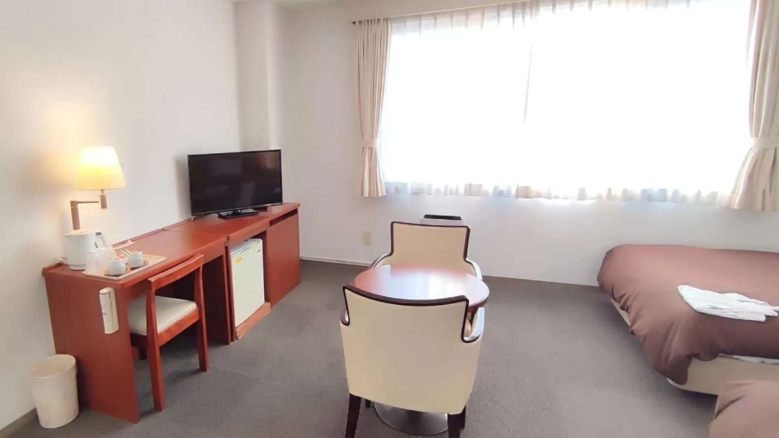 Communal lounge/ TV room, Bed in Utazu Grand Hotel