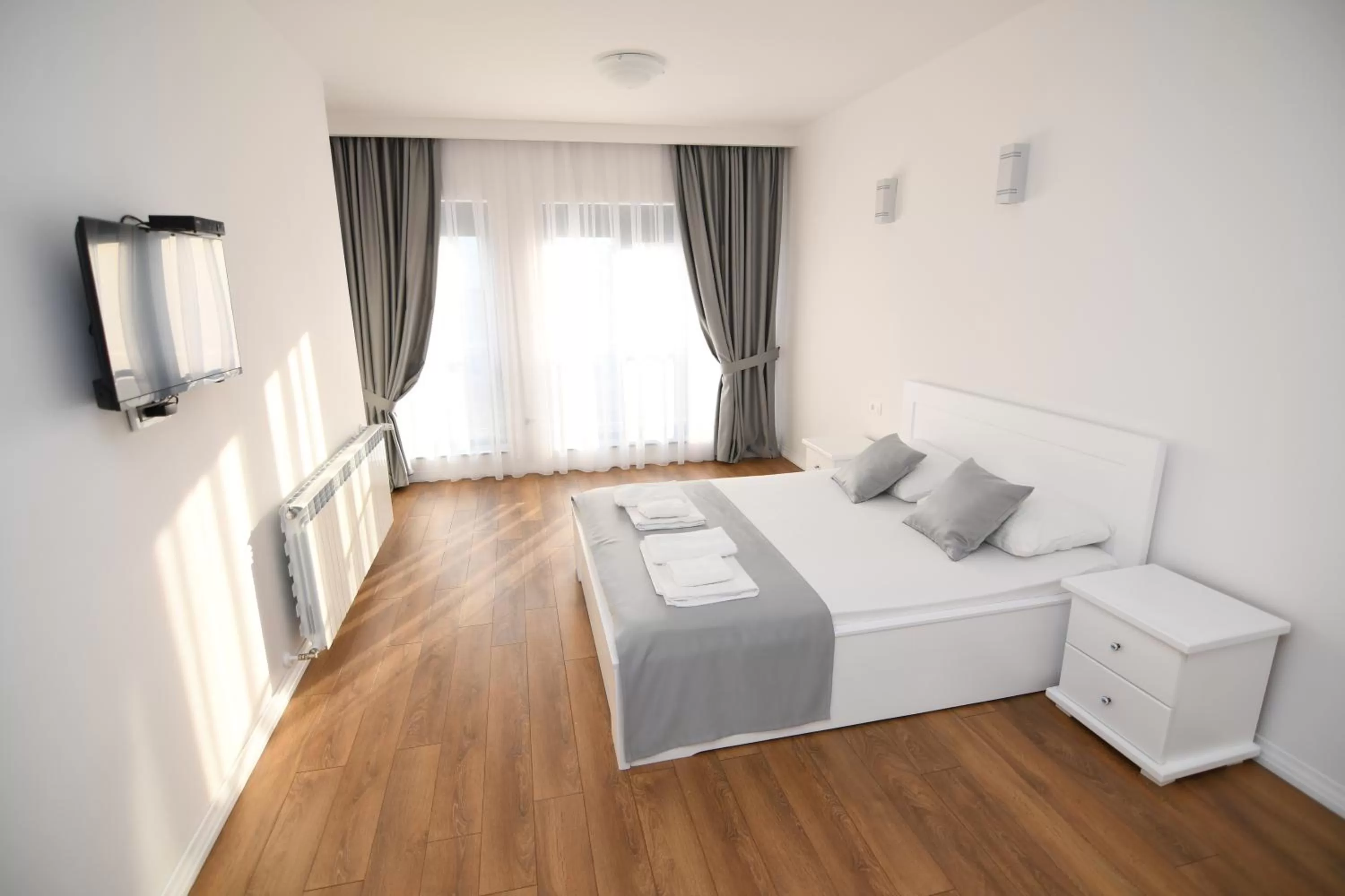 Bed in Elan Luxury Apartments & Rooms