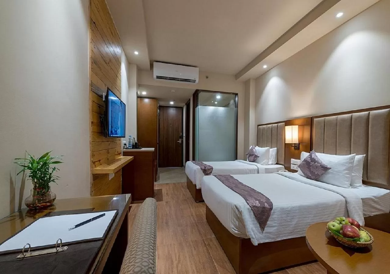 Bed in Hotel Cachar Club