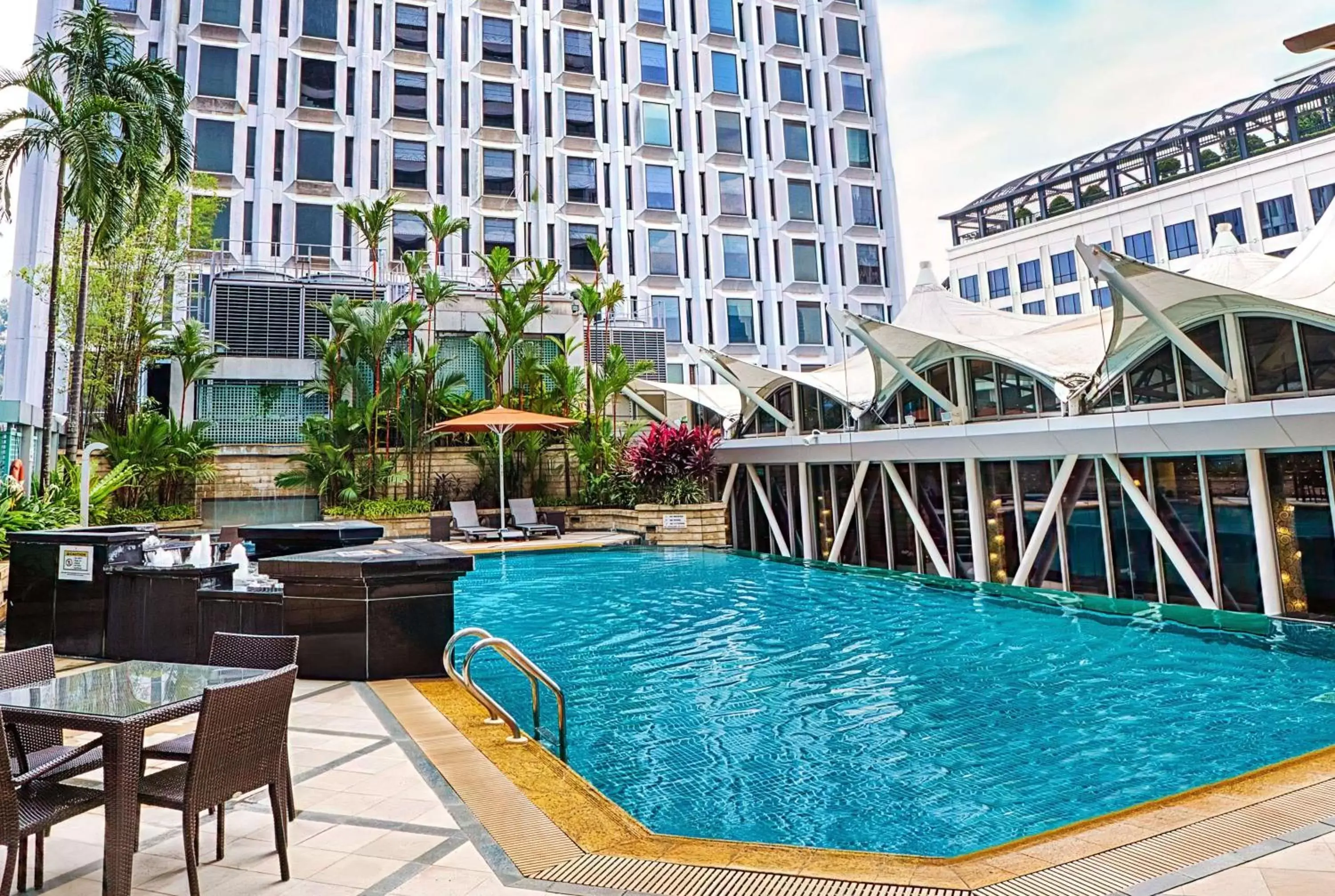 Property building, Swimming Pool in Peninsula Excelsior Singapore, A Wyndham Hotel