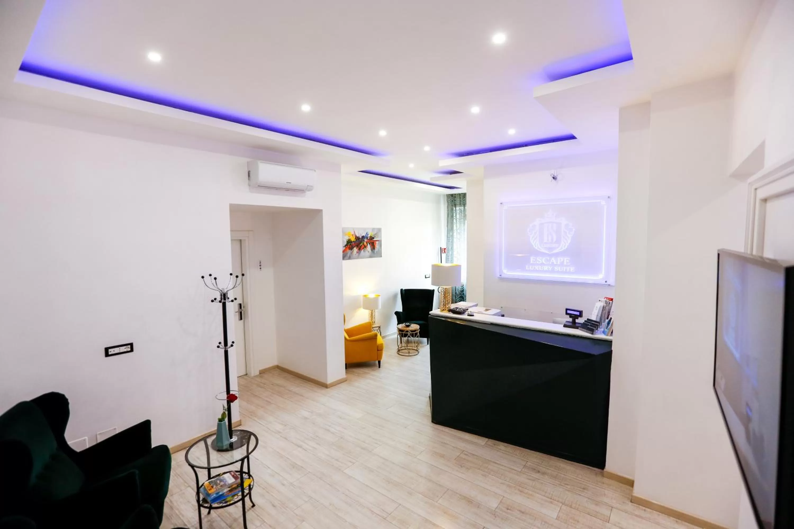 Communal lounge/ TV room in Escape Luxury Suite - CA Domus Collection