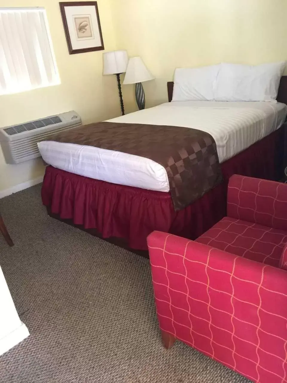 Bed in Europa Inn & Suites