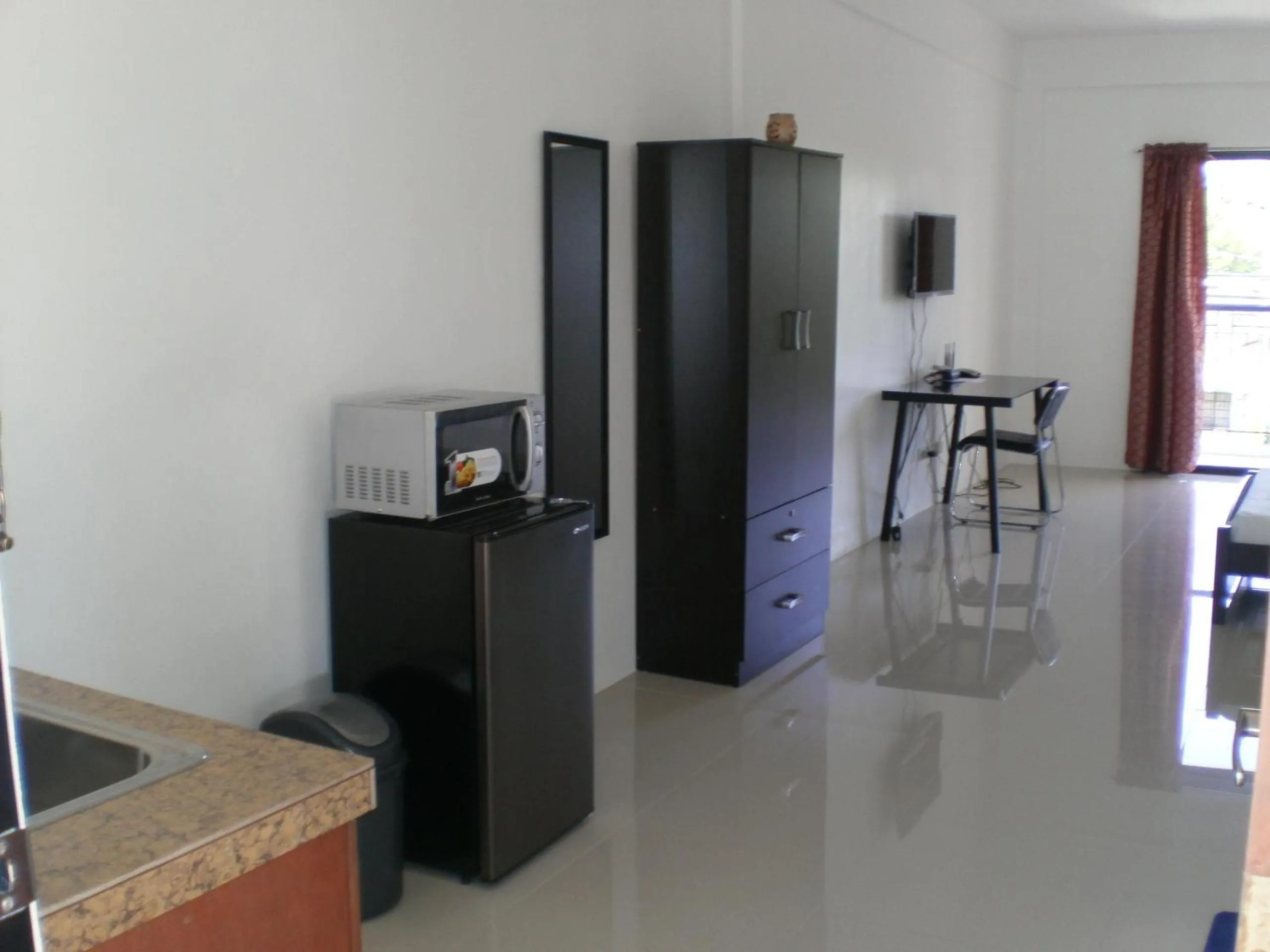 Photo of the whole room in The Palines Apartment Hotel near Brittany Palazzo, Evia Mall Alabang