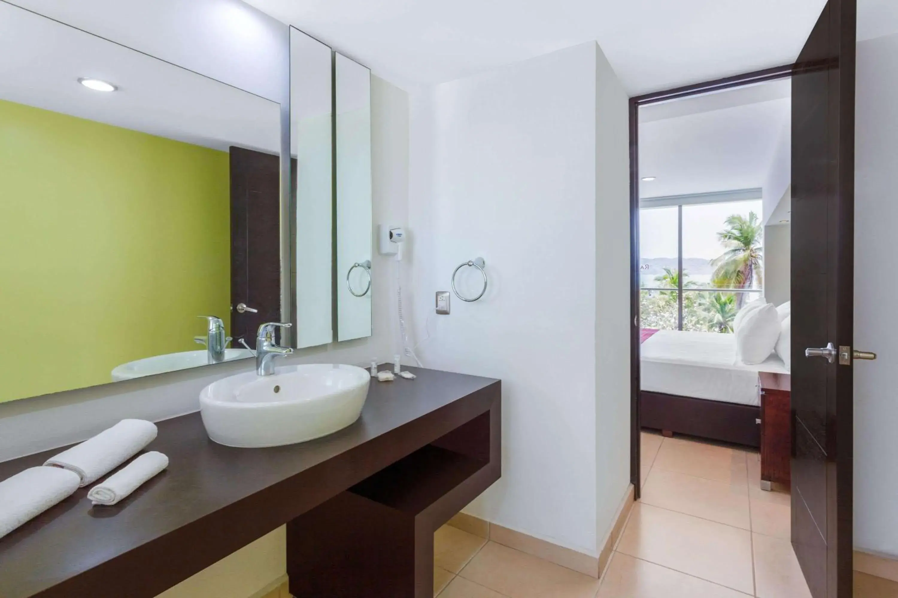 Bathroom in Ramada by Wyndham Acapulco Hotel & Suites