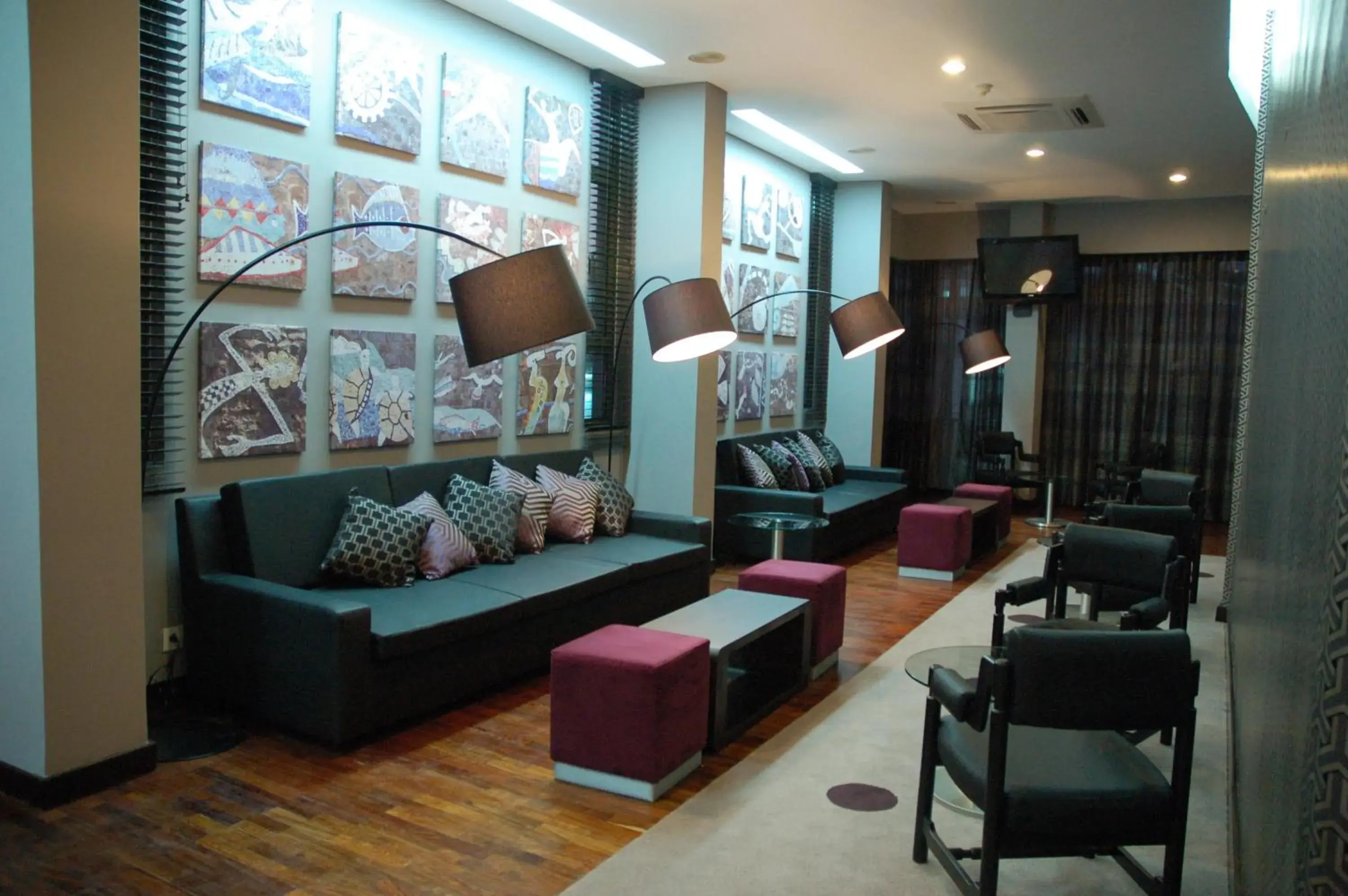 Communal lounge/ TV room, Seating Area in Tivoli Maputo