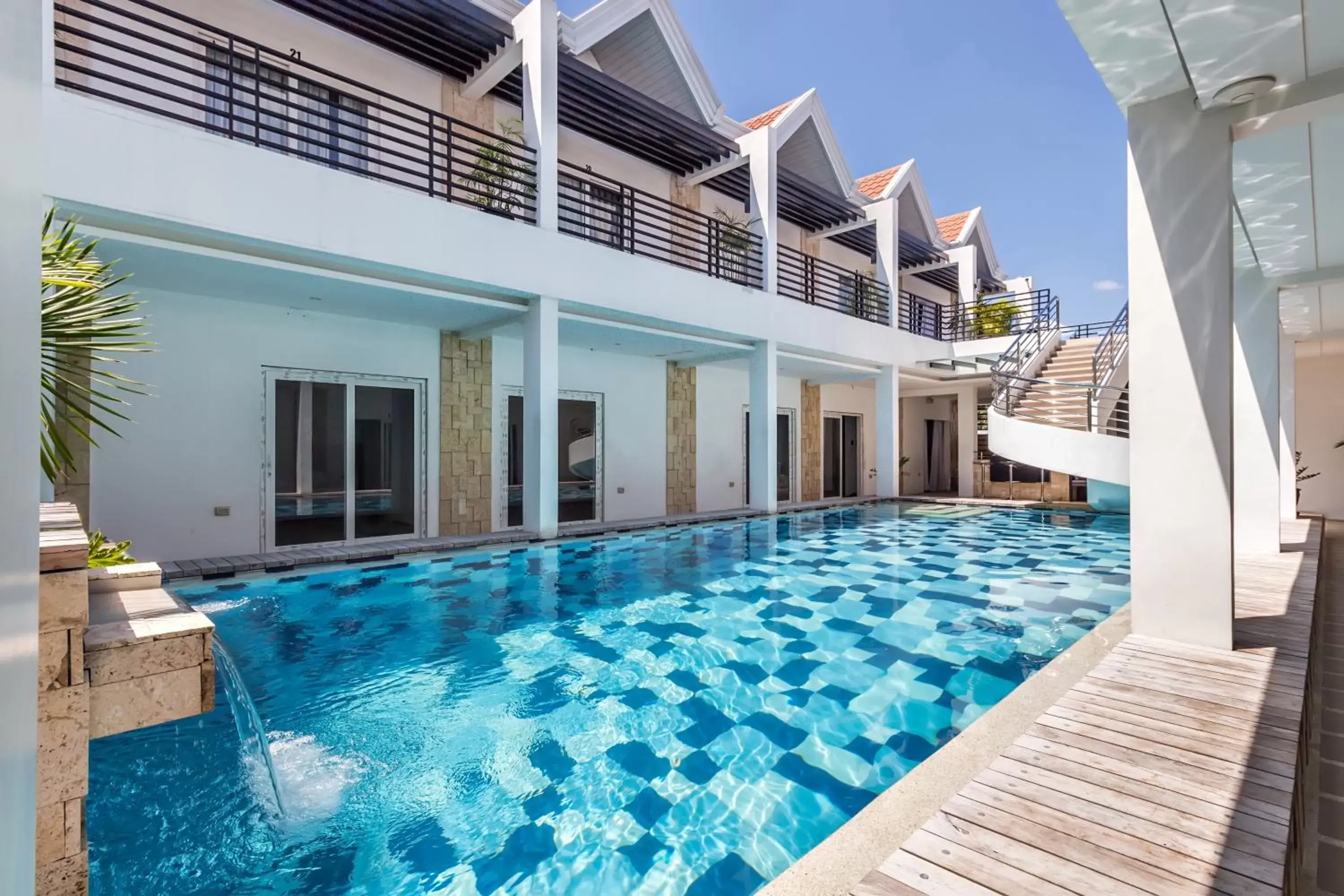 Swimming pool, Property Building in Winds Boutique Hotel