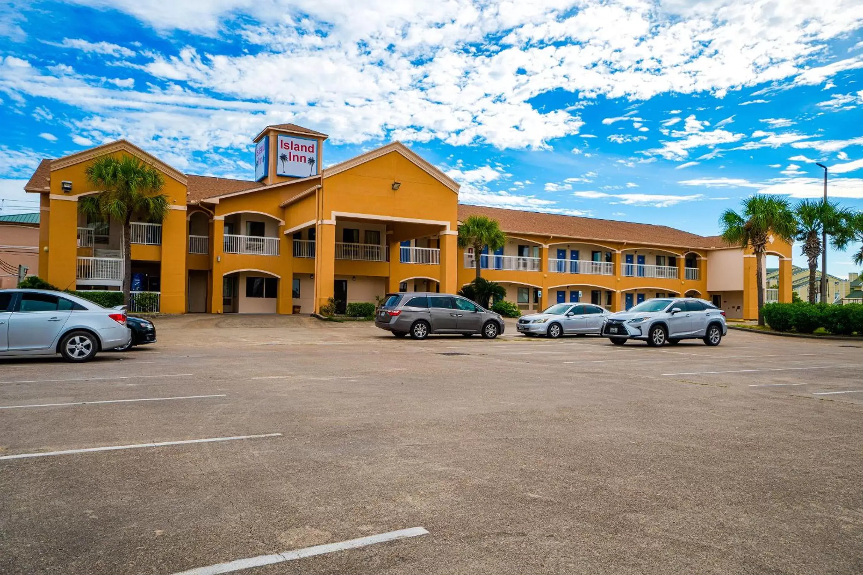 Parking, Property Building in Island Inn By OYO Galveston Beach, TX