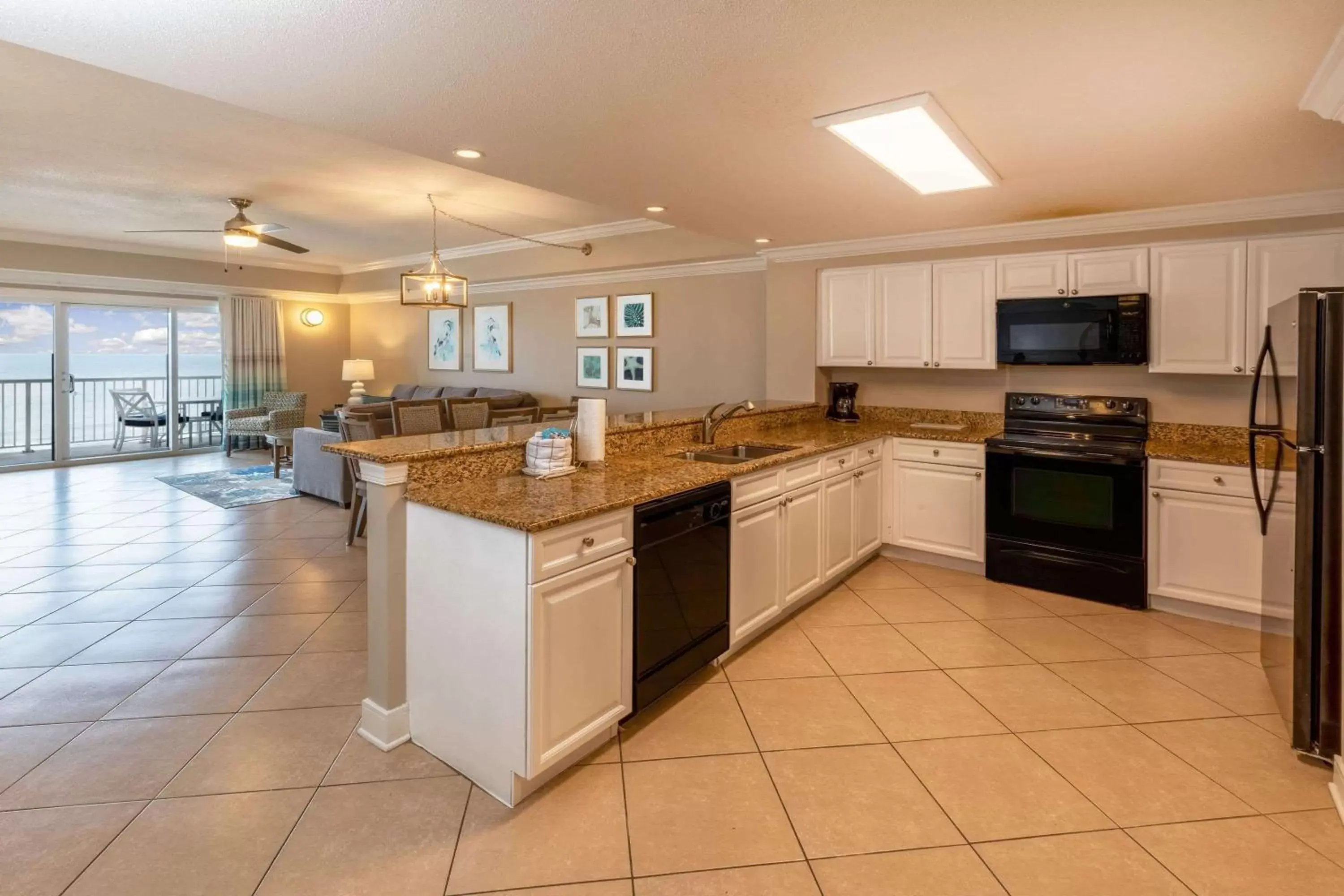 Photo of the whole room, Kitchen/Kitchenette in Escapes! To The Shores Orange Beach, A Ramada by Wyndham