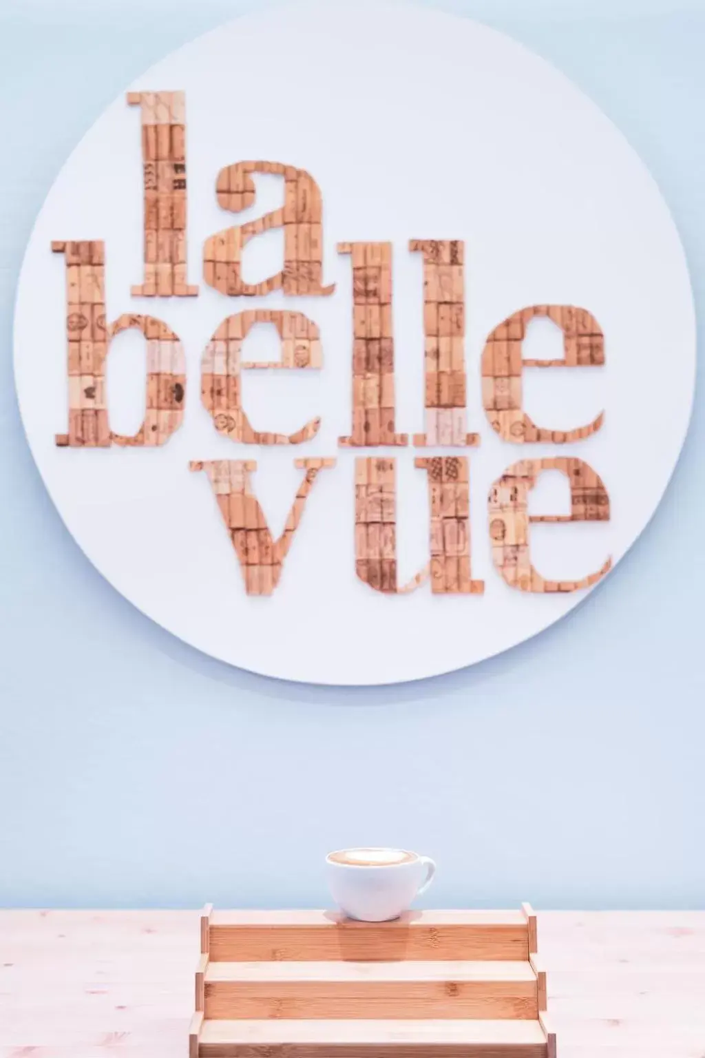 Property logo or sign in la belle vue Boutique Hotel & Café