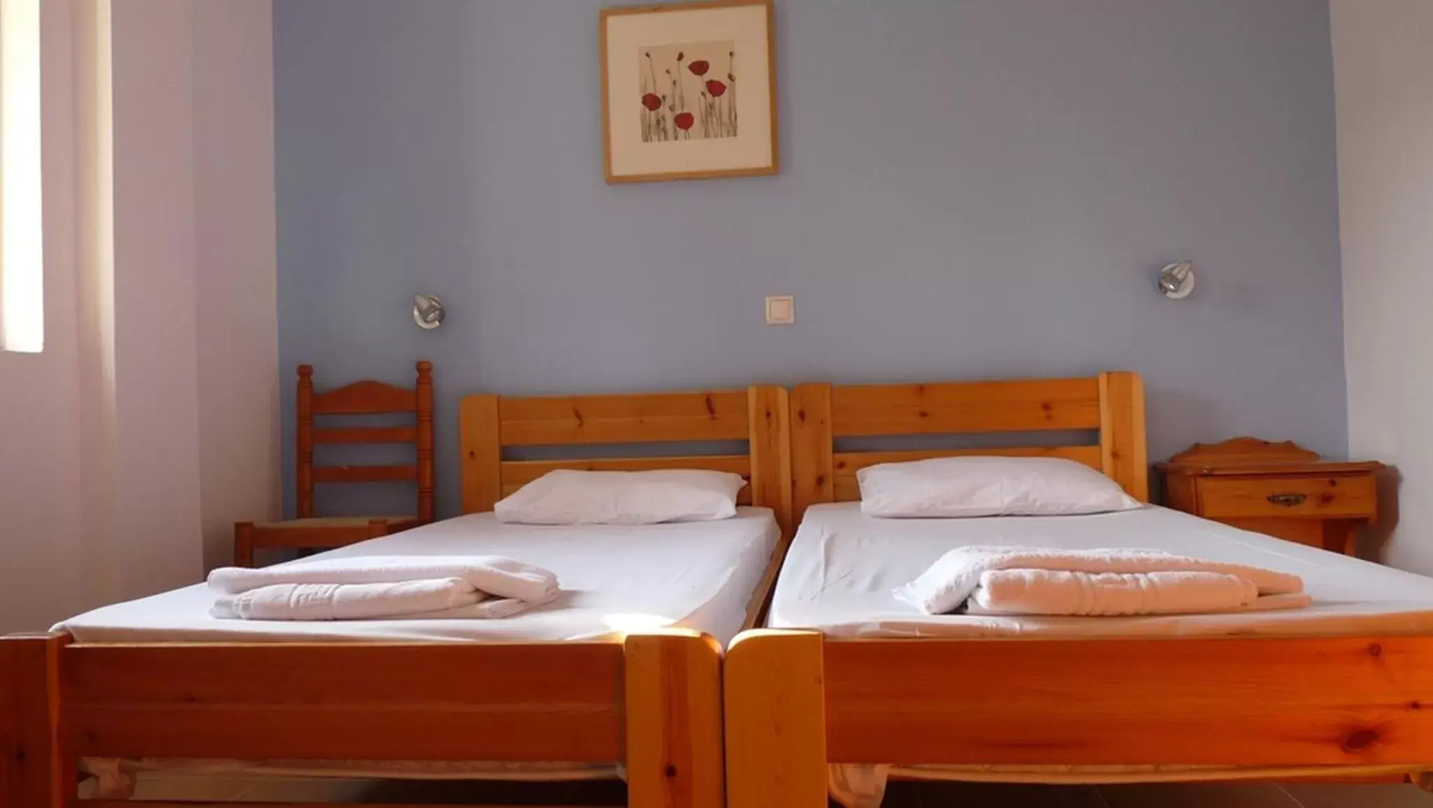 Bed in Nikolaki Rooms