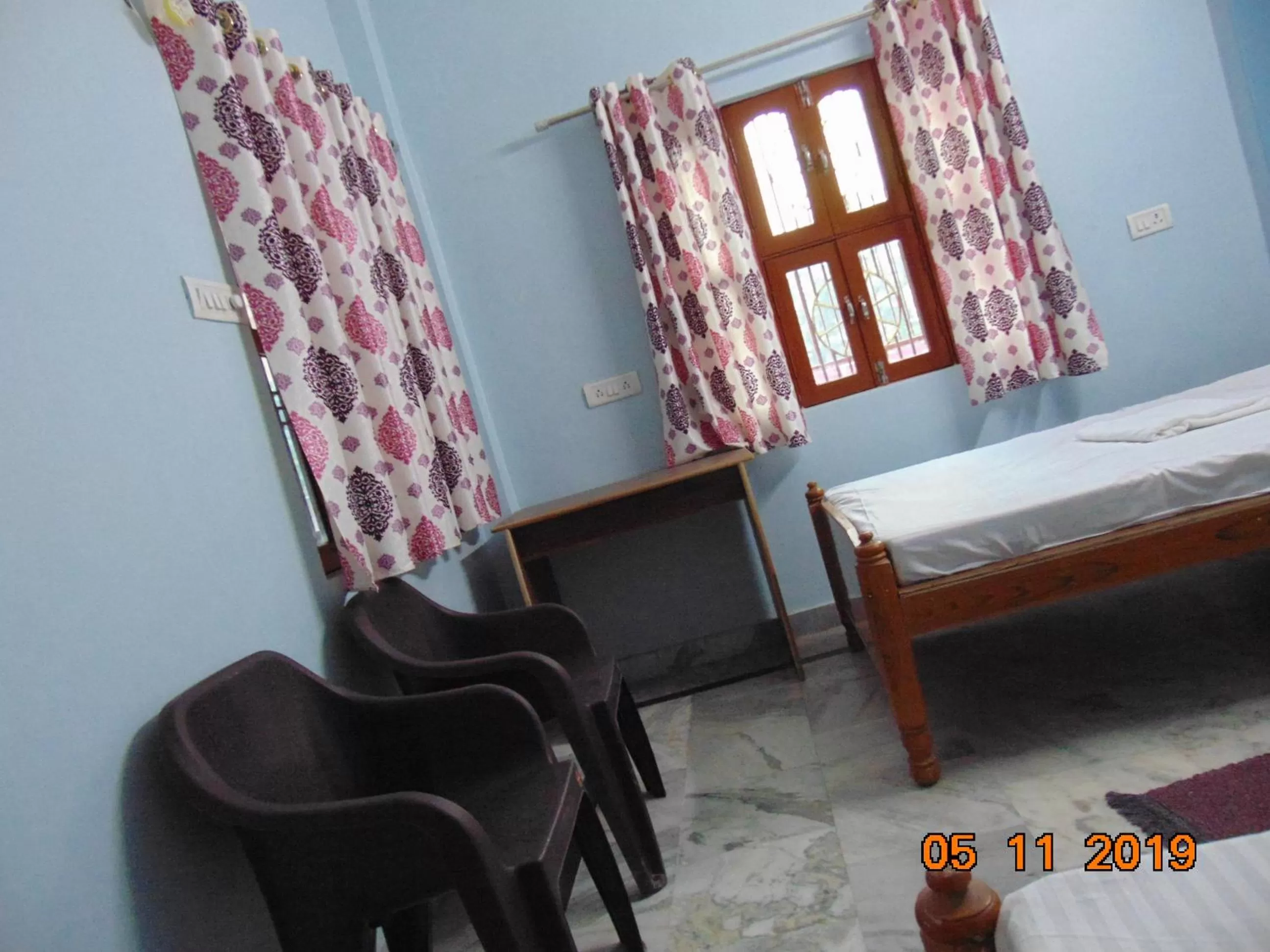 Seating area, Bed in Mahamaya Paying Guest House