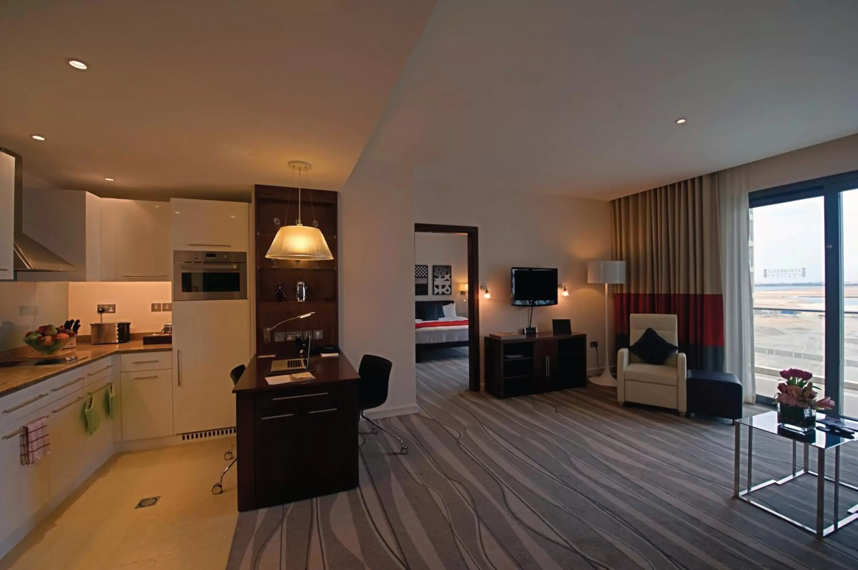 Photo of the whole room, Kitchen/Kitchenette in Staybridge Suites Yas Island Abu Dhabi, an IHG Hotel