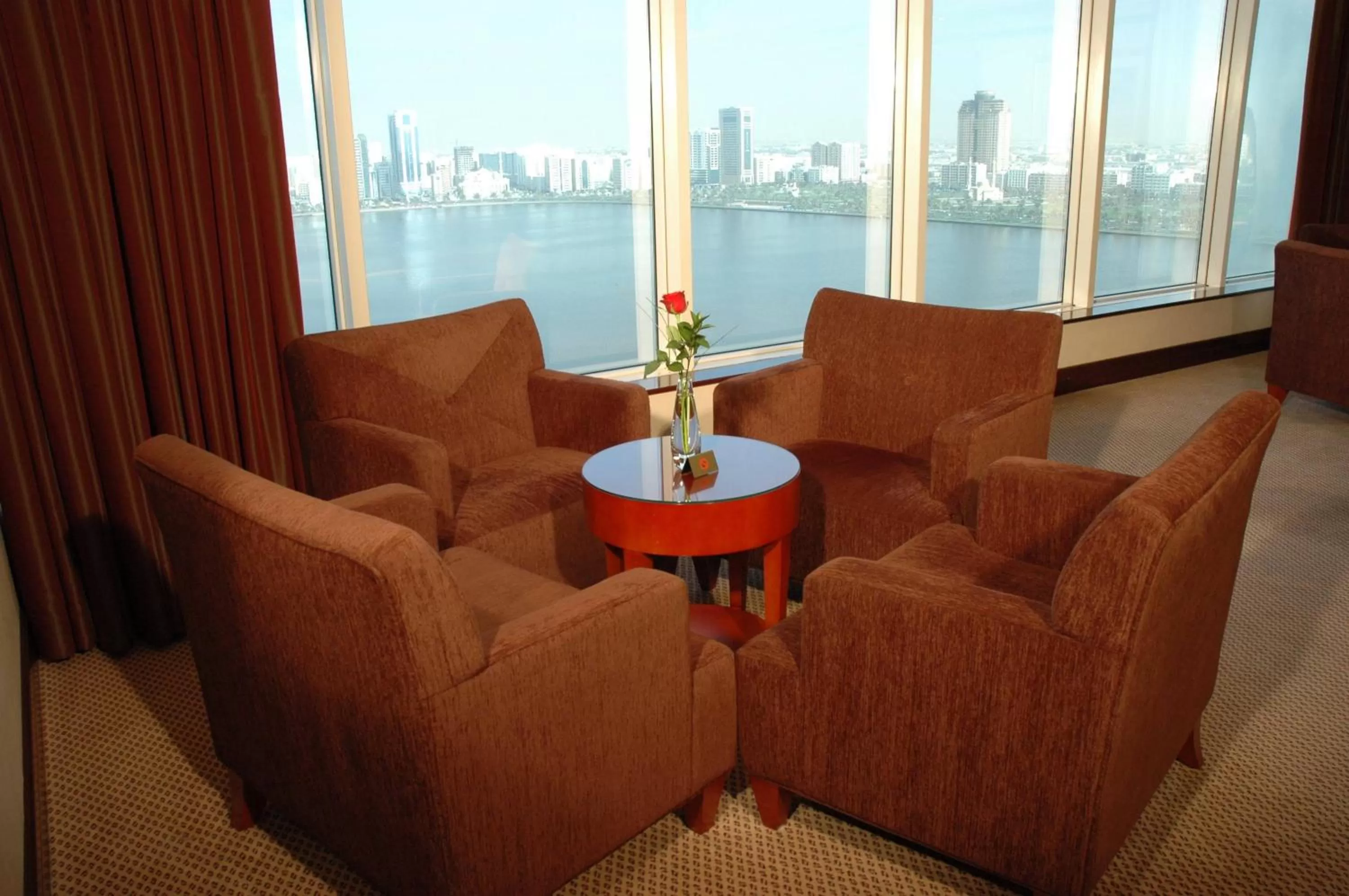 Communal lounge/ TV room in Corniche Hotel Sharjah