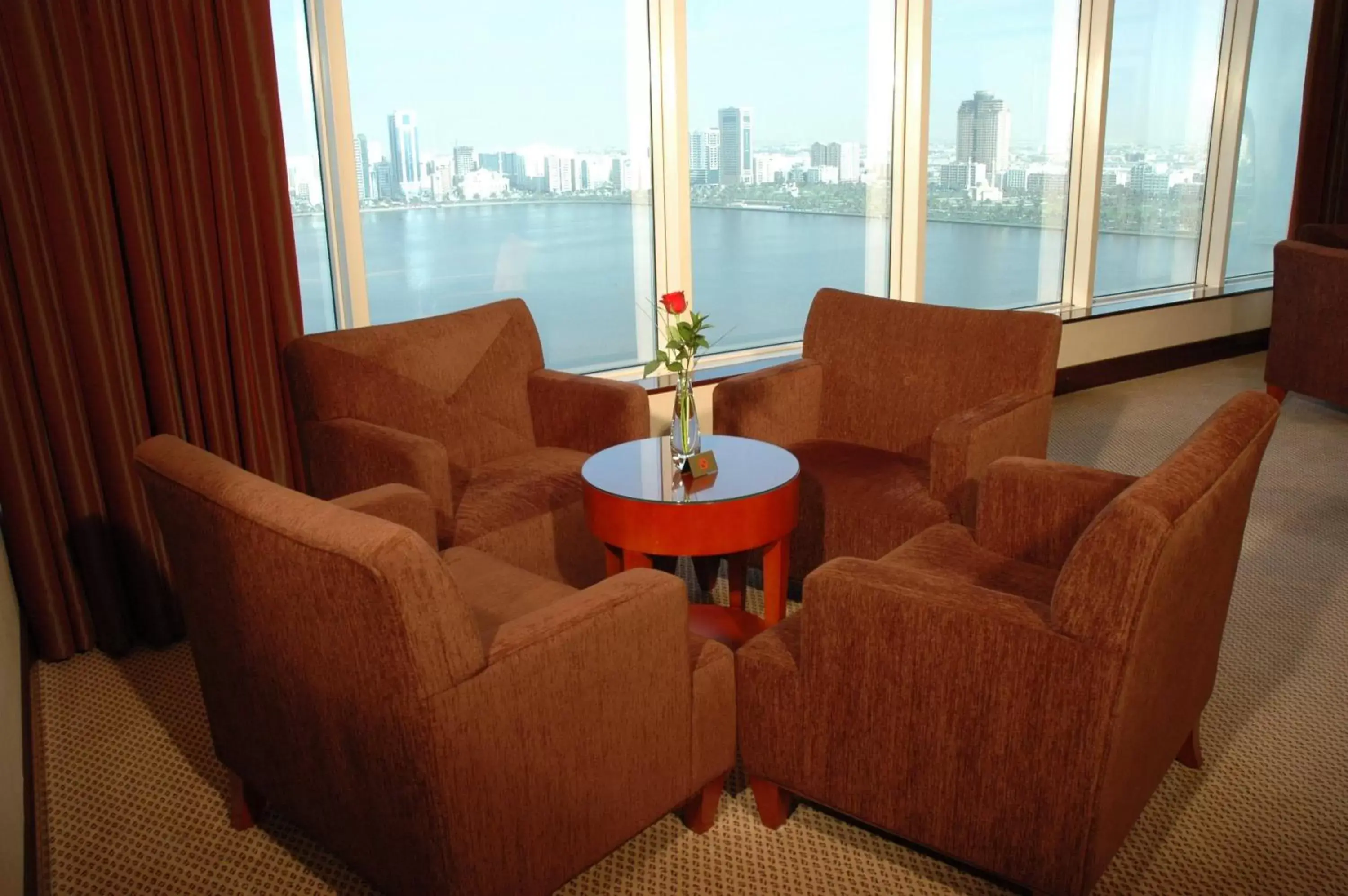 Communal lounge/ TV room, Seating Area in Corniche Hotel Sharjah