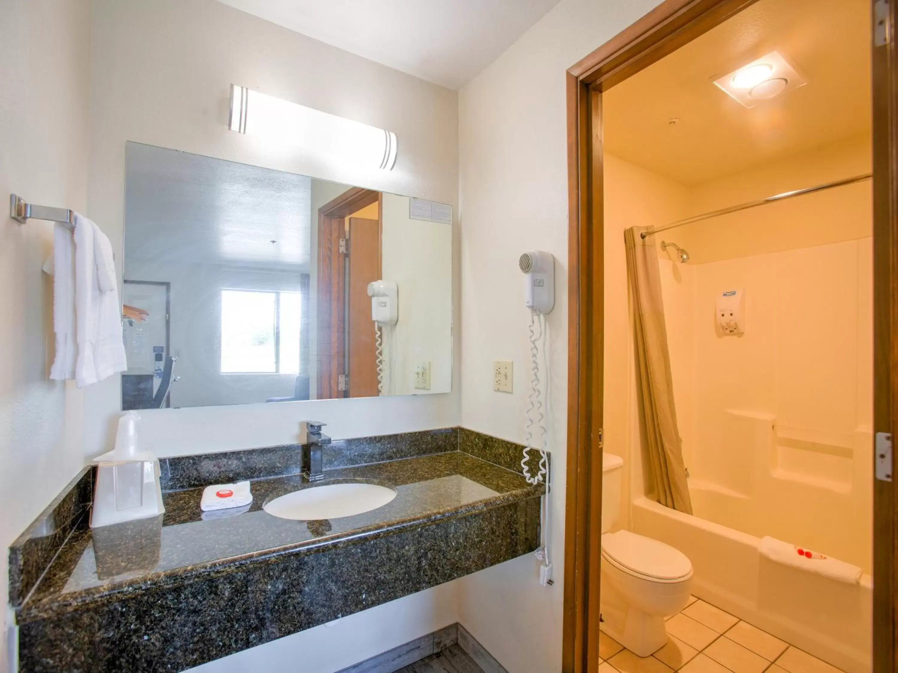 Bathroom in OYO Woodland Hotel and Suites