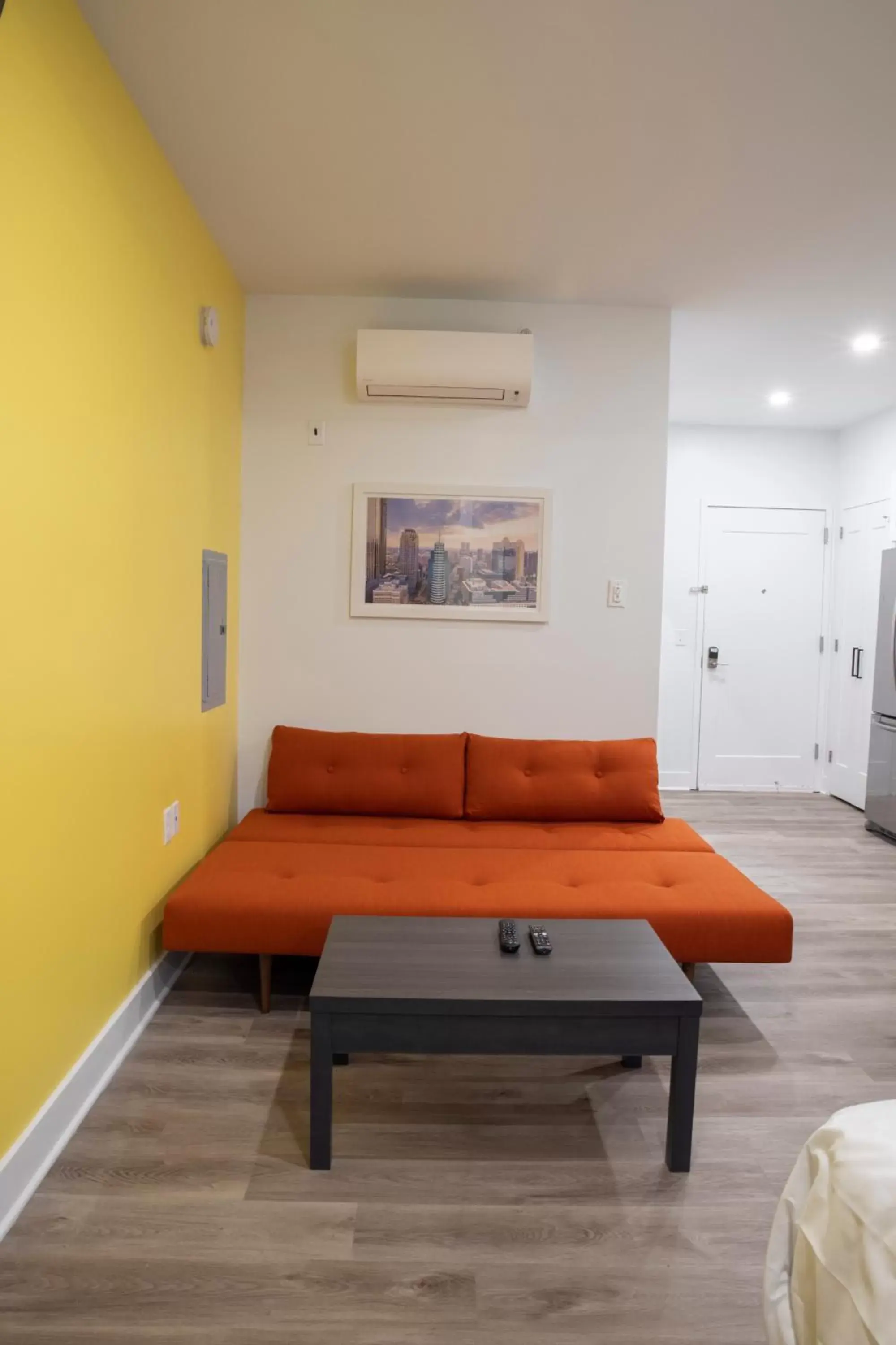 Bed, Seating Area in Peachtree Suites - Jersey City