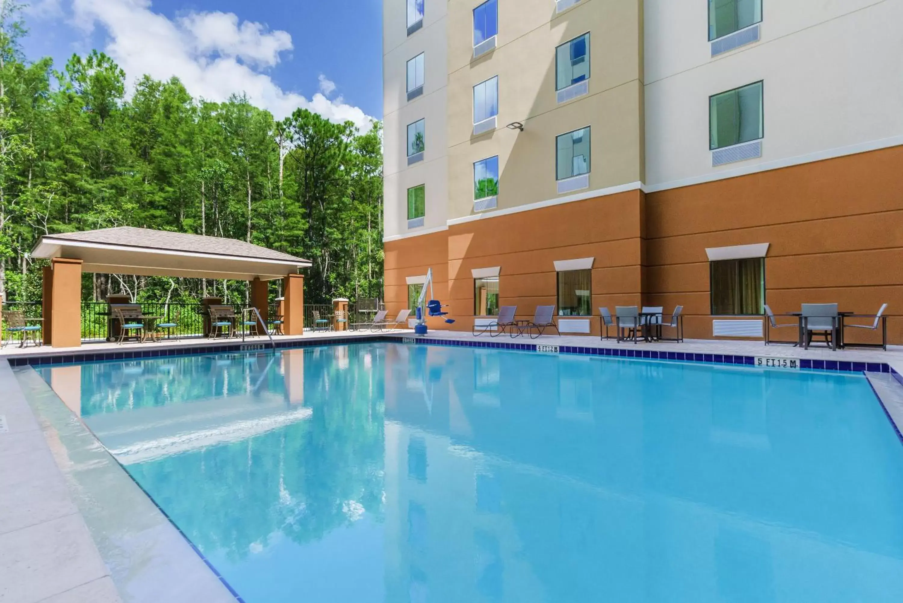 BBQ facilities, Swimming Pool in Candlewood Suites - Orlando - Lake Buena Vista, an IHG Hotel