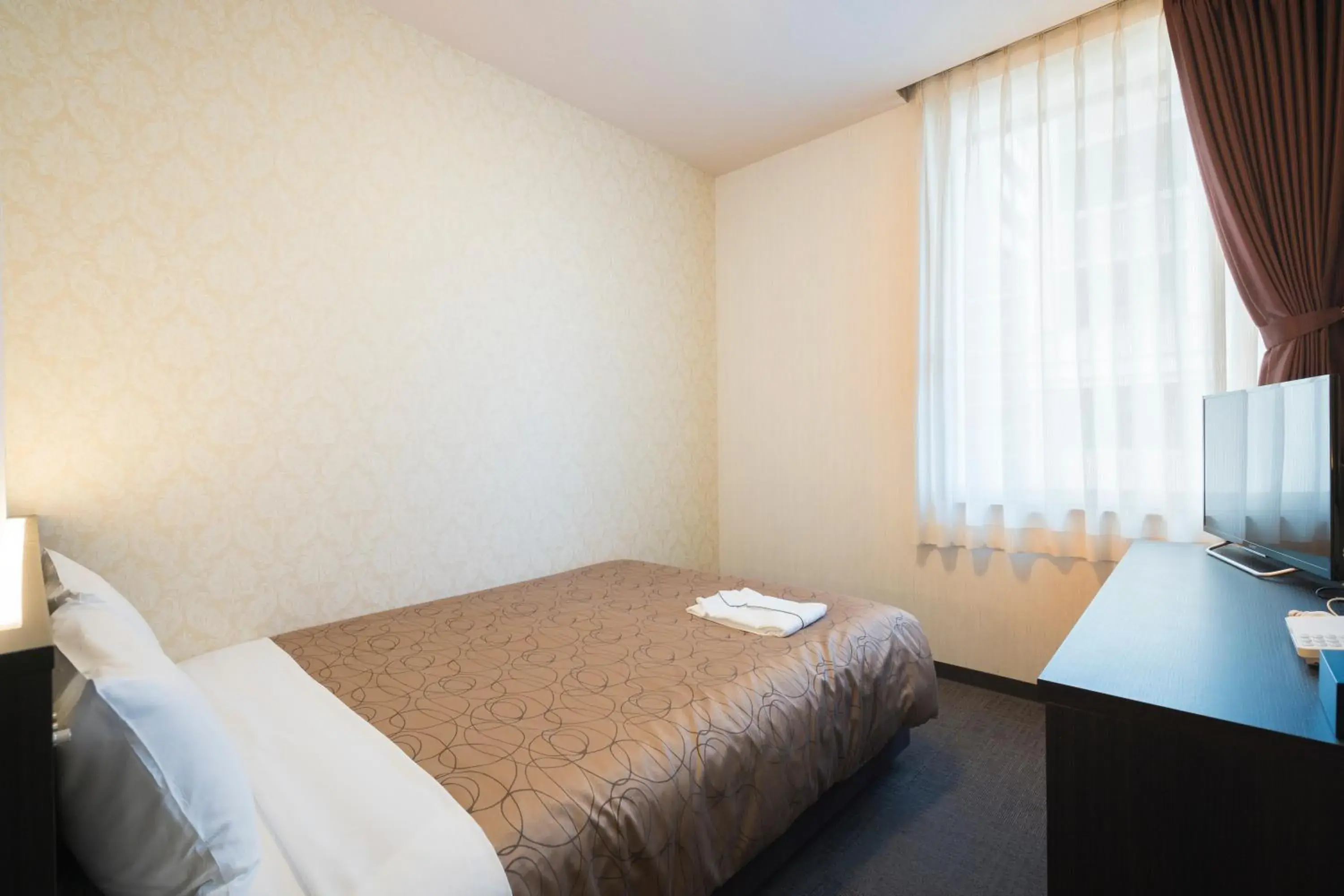 Photo of the whole room, Bed in Hotel Hakata Nakasu Inn