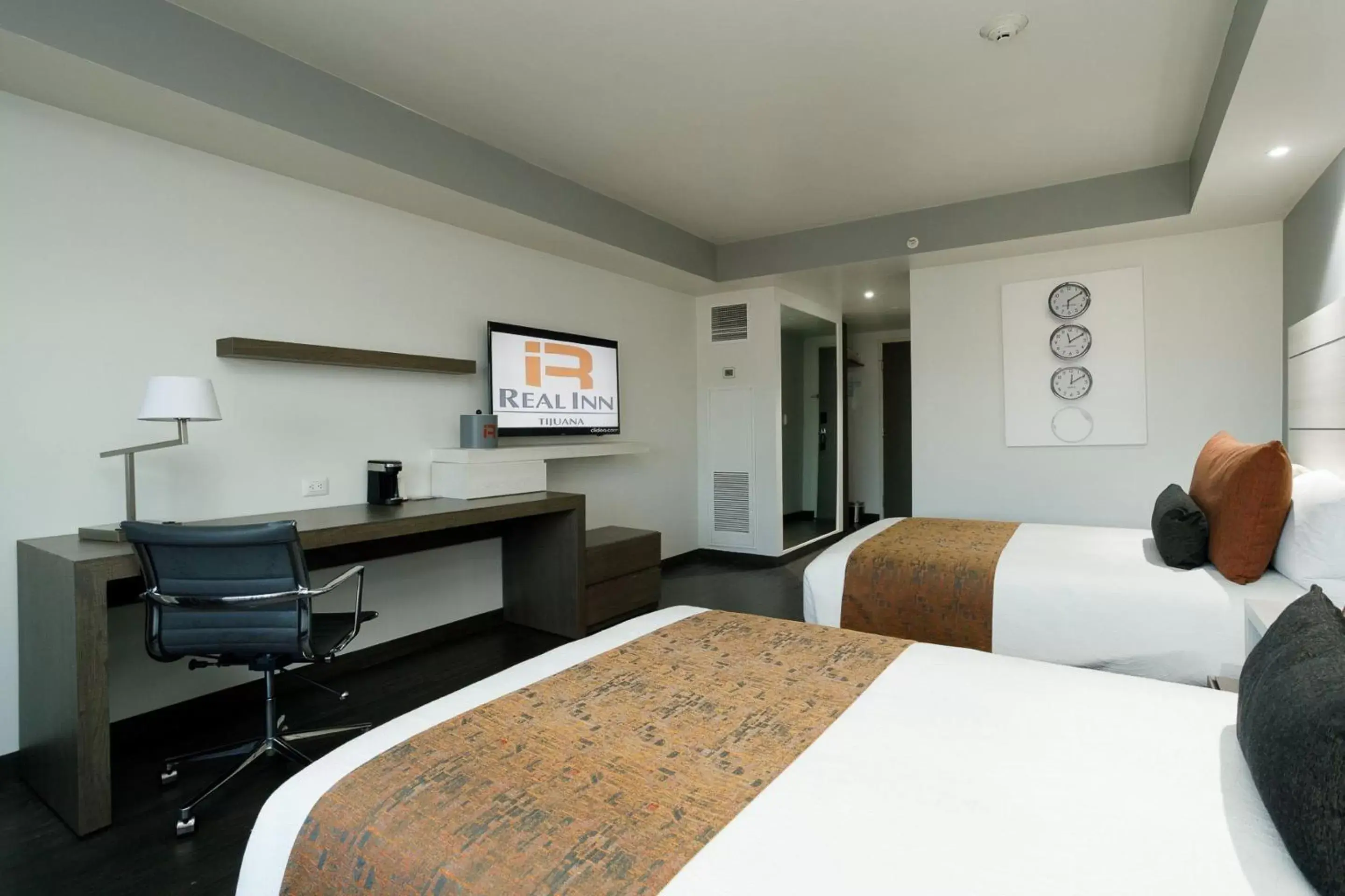 Bedroom, TV/Entertainment Center in Real Inn Tijuana by Camino Real Hotels