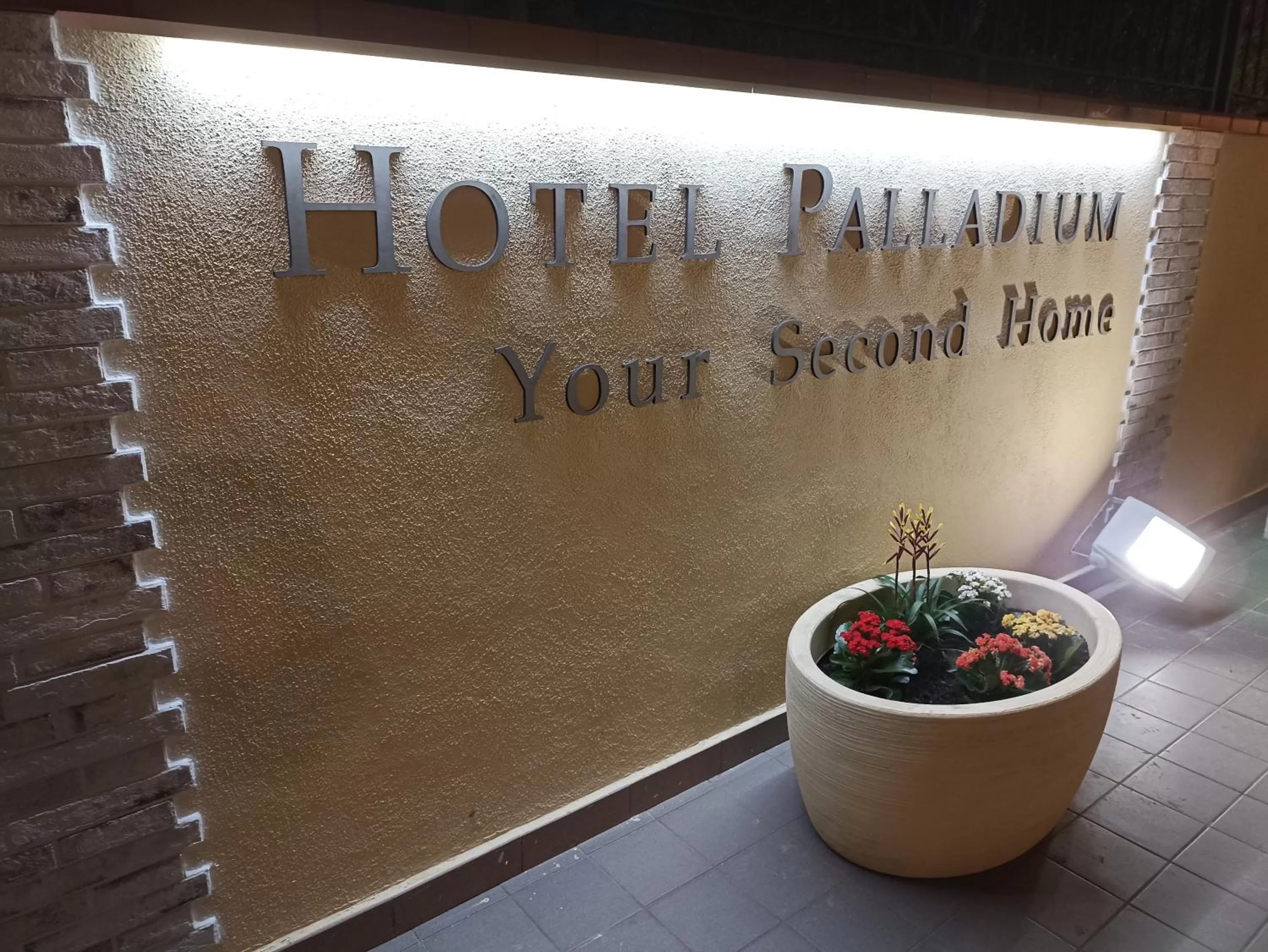 Property logo or sign in Hotel Palladium