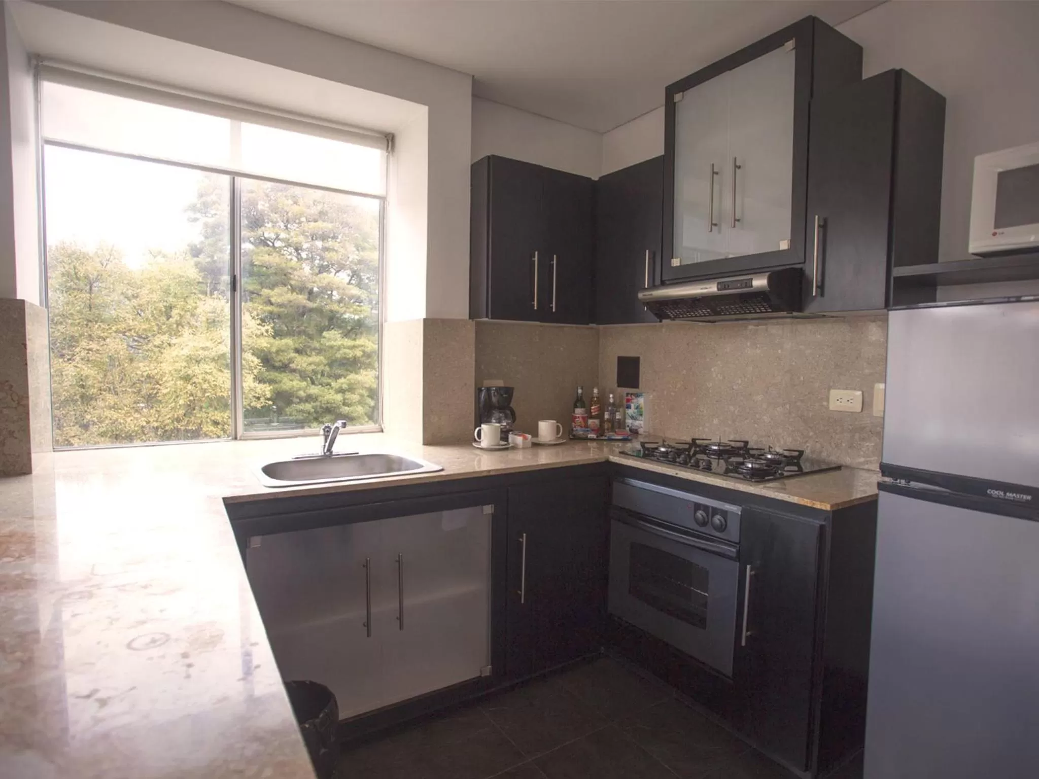 Kitchen or kitchenette in Hotel 104 Art Suites