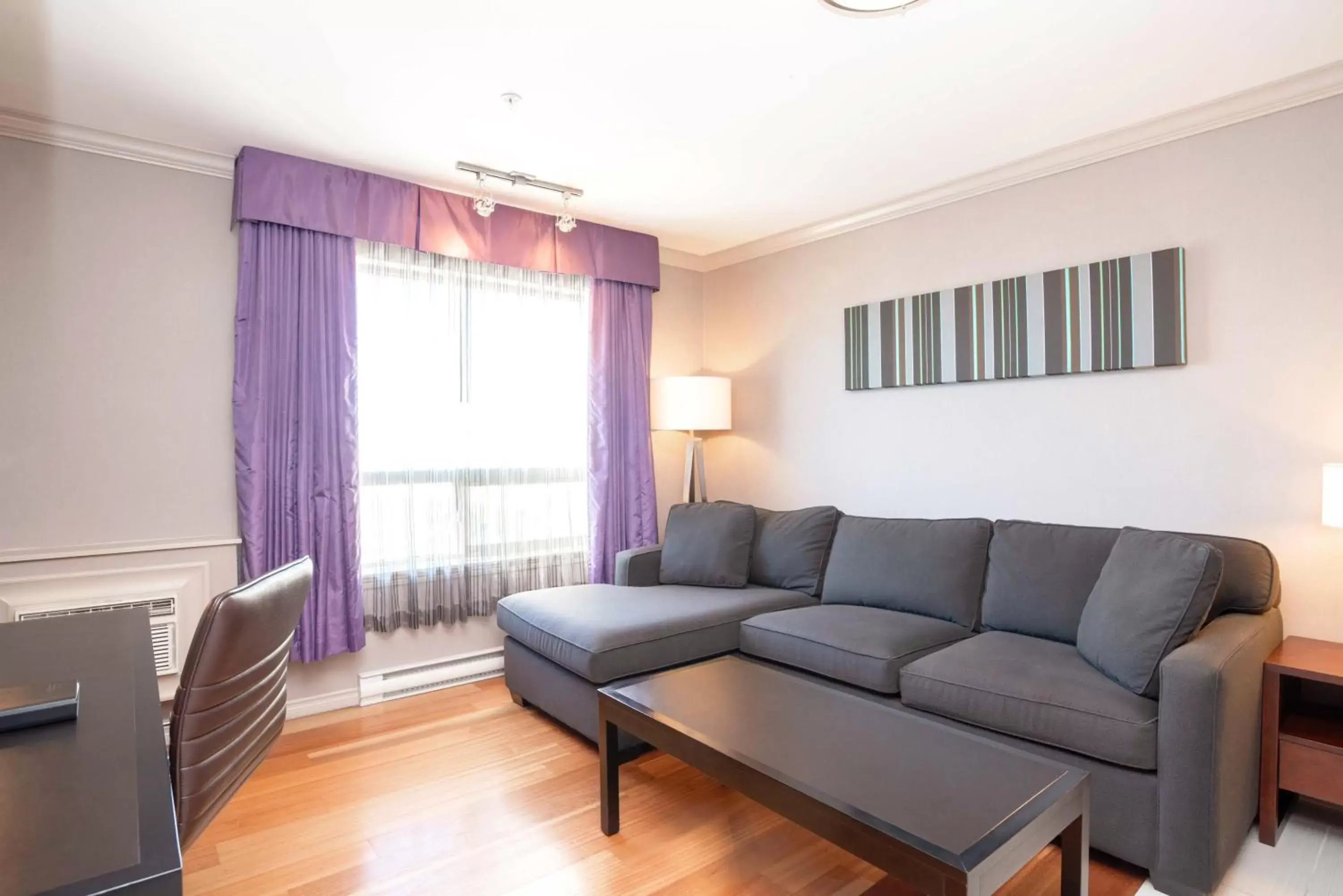 Photo of the whole room, Seating Area in Sandman Hotel & Suites Winnipeg Airport