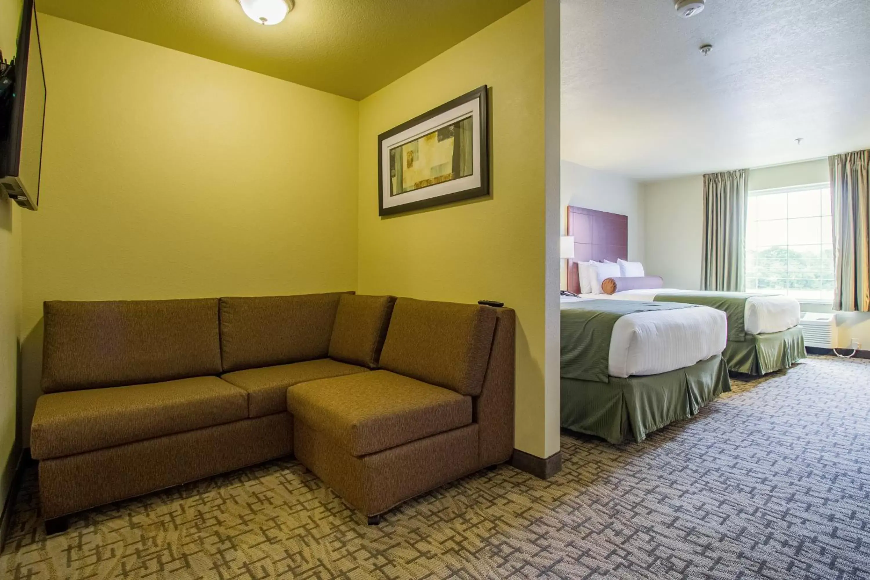 Bedroom, Seating Area in Cobblestone Hotel & Suites - Orrville