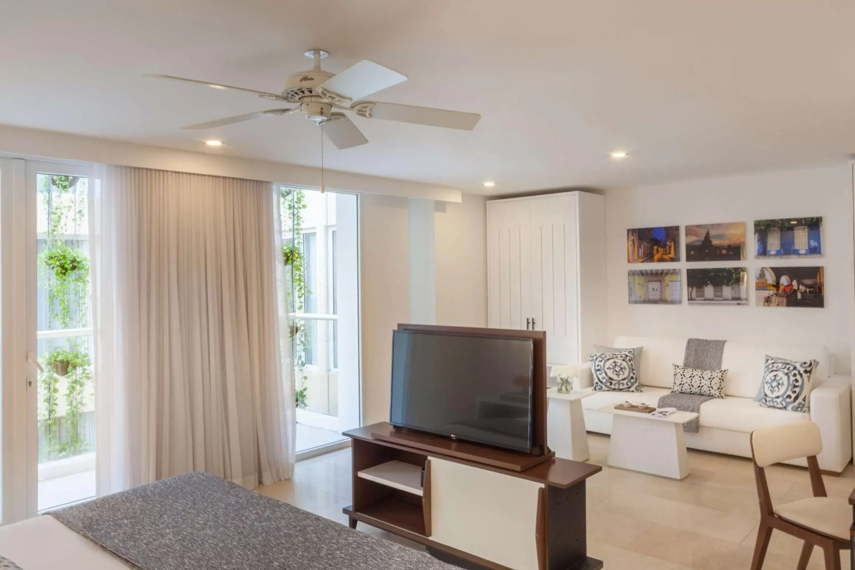 Living room, TV/Entertainment Center in Nacar Hotel Cartagena, Curio Collection by Hilton