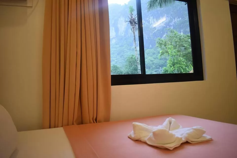 Bed in Jurias Garden Hotel