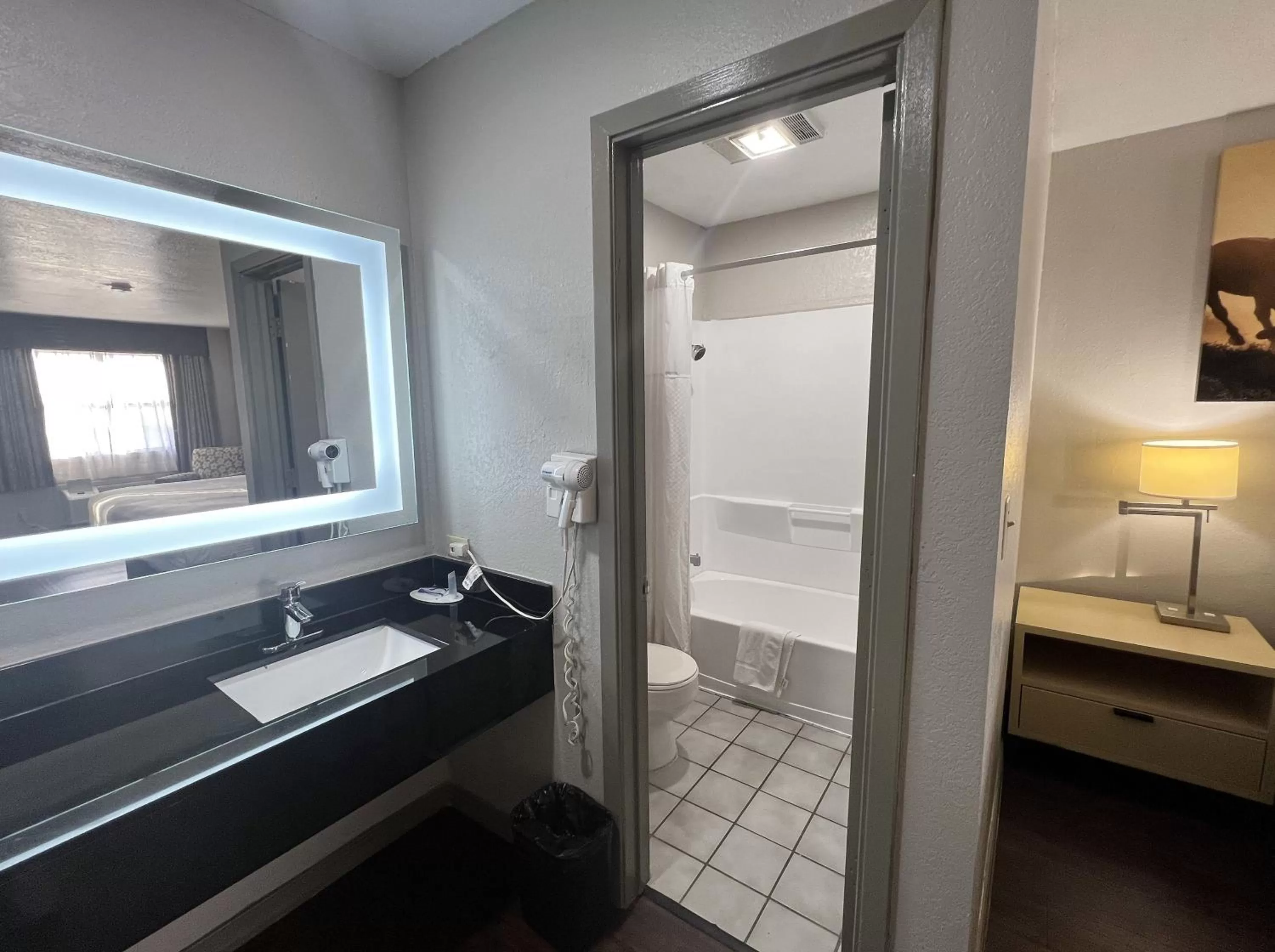 Bathroom in Days Inn & Suites by Wyndham - Canton First Monday Trade Days