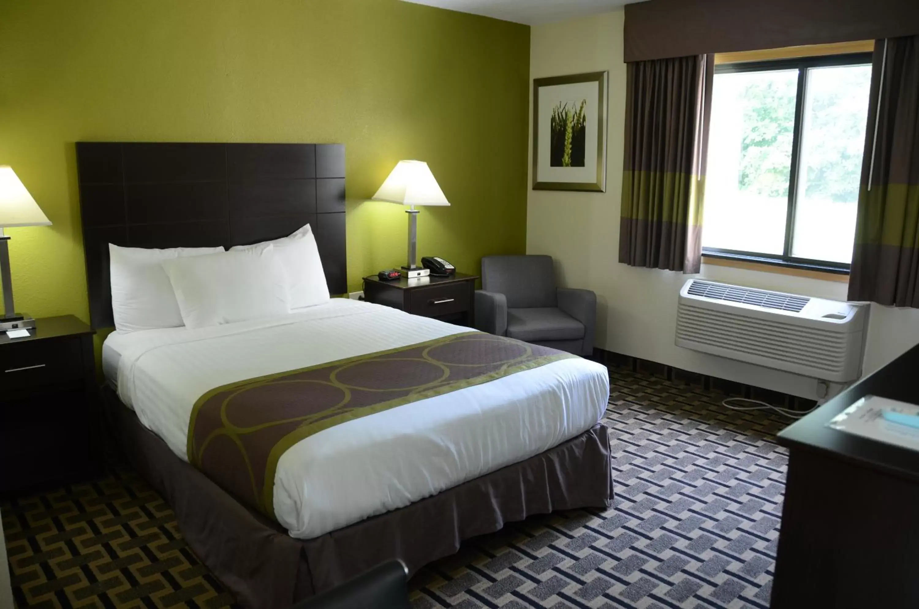 Bed in AmericInn by Wyndham West Burlington