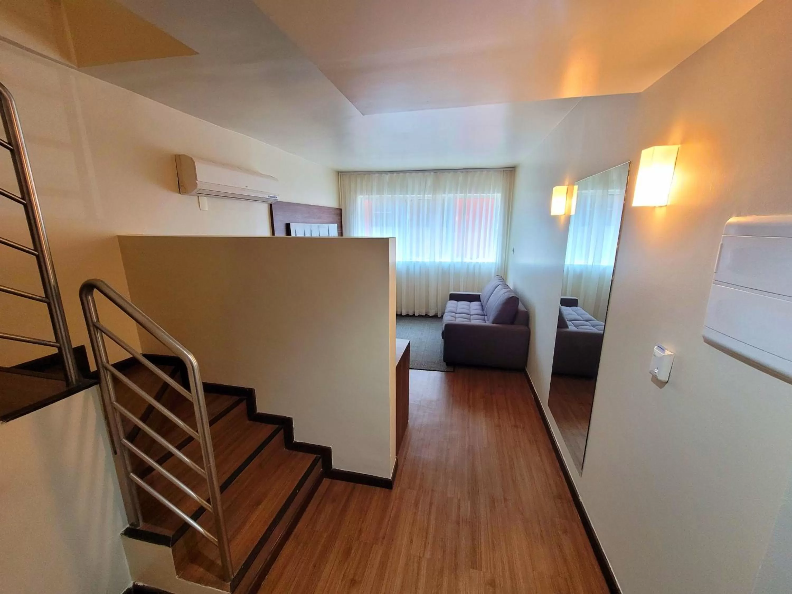 Living room, Bed in BH Raja Hotel