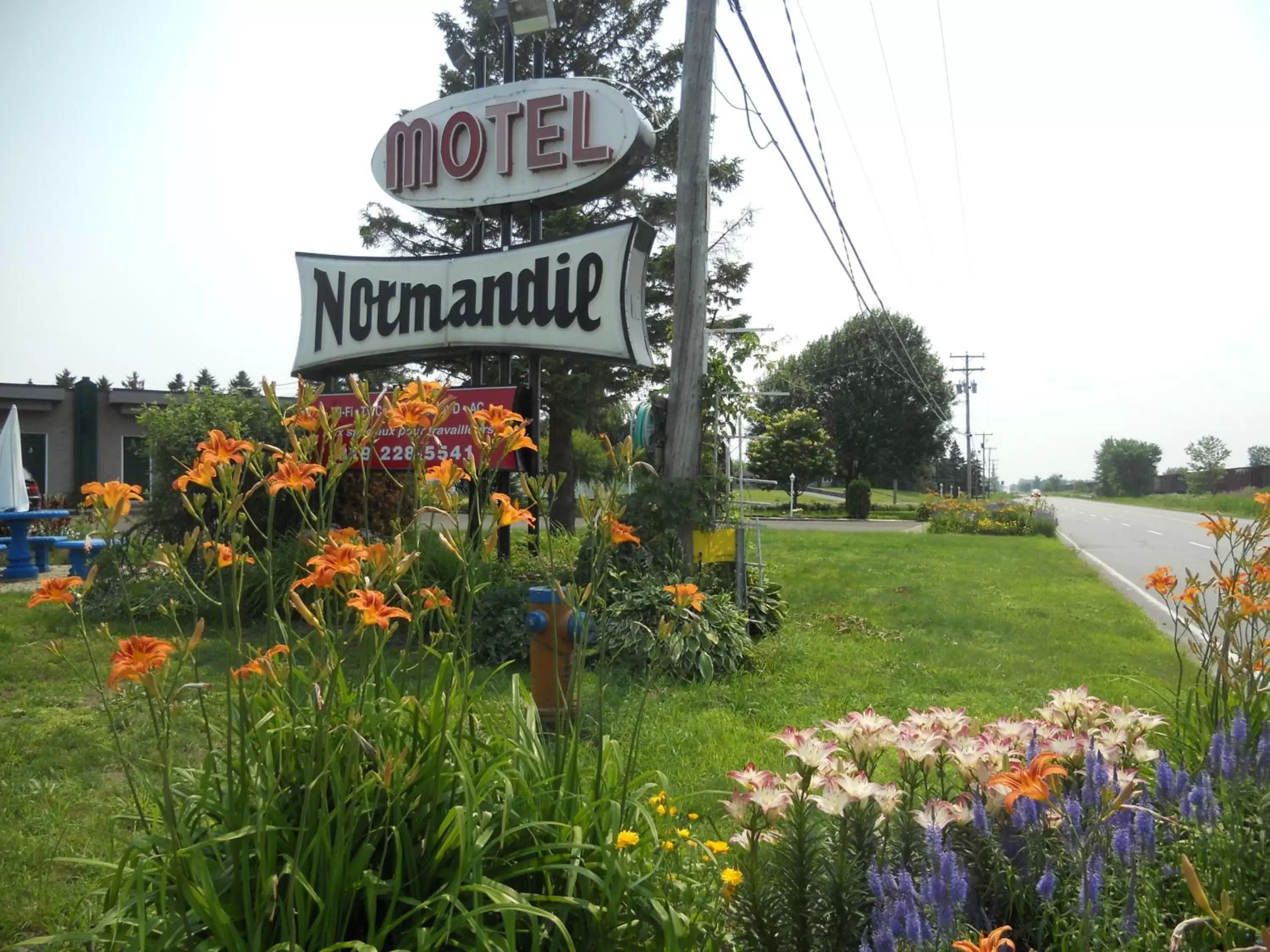 Property logo or sign, Property Building in Motel Normandie