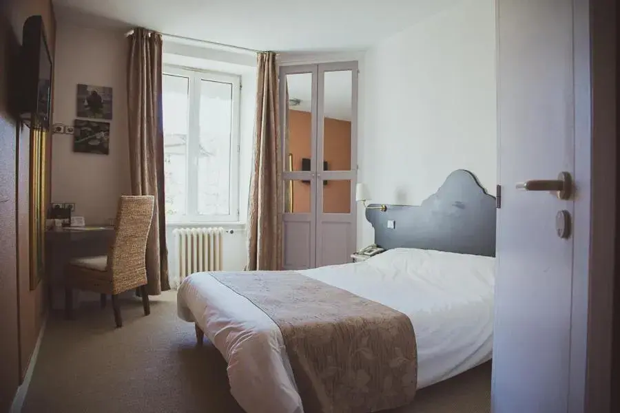 Photo of the whole room, Bed in Hôtel Logis Le Bourbon