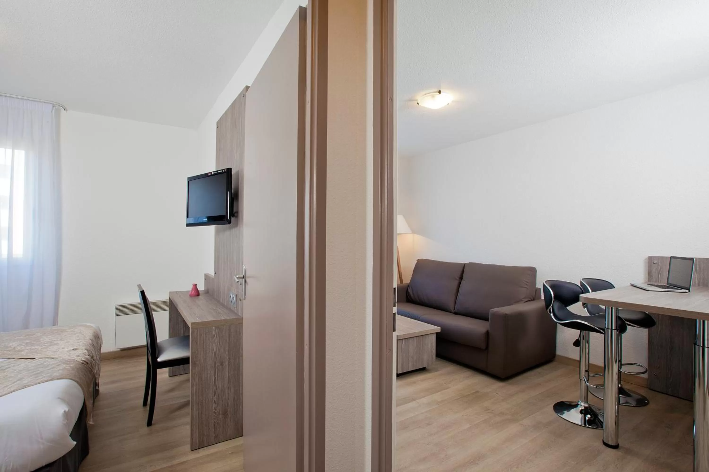 Seating area, Bed in Séjours & Affaires Reims Clairmarais