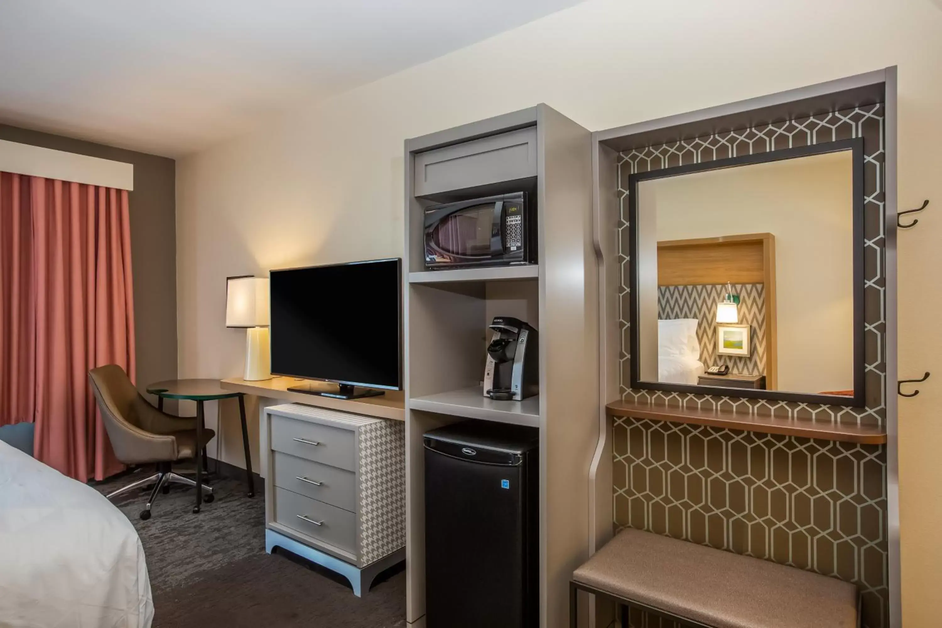 Photo of the whole room, TV/Entertainment Center in Holiday Inn - Gulfport-Airport, an IHG Hotel