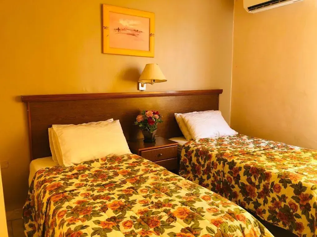Bed in Sufara Hotel Suites